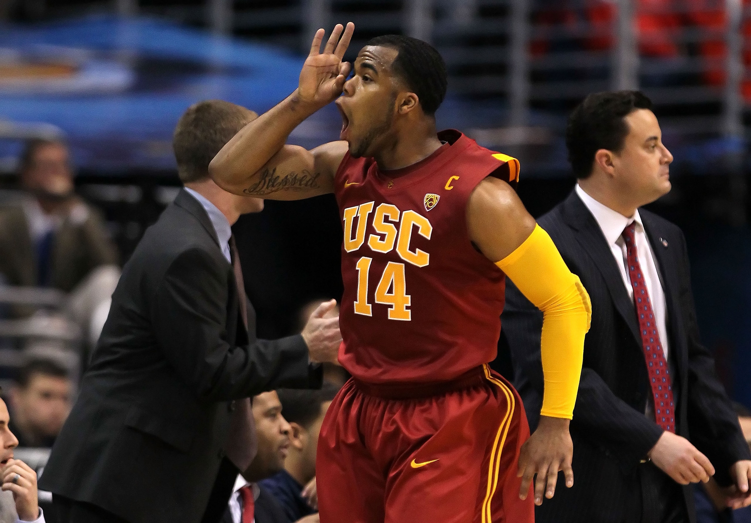 LOS ANGELES, CA - MARCH 11:  Donte Smith #14 of the USC Trojans reacts after making a basket in the first half against the Arizona Wildcats in the semifinals of the 2011 Pacific Life Pac-10 Men's Basketball Tournament at Staples Center on March 11, 2011 i