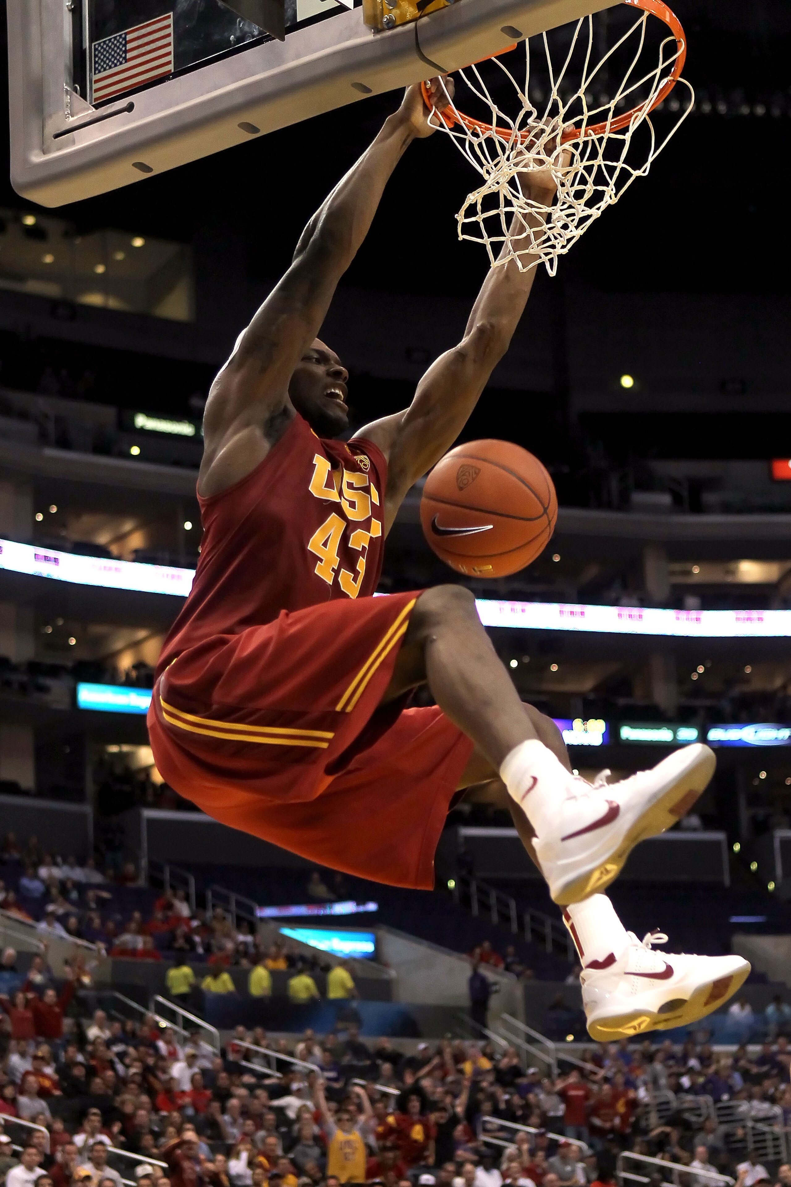 LOS ANGELES, CA - MARCH 11:  Marcus Simmons #43 of the USC Trojans dunks the ball in the first half while taking on the Arizona Wildcats in the semifinals of the 2011 Pacific Life Pac-10 Men's Basketball Tournament at Staples Center on March 11, 2011 in L