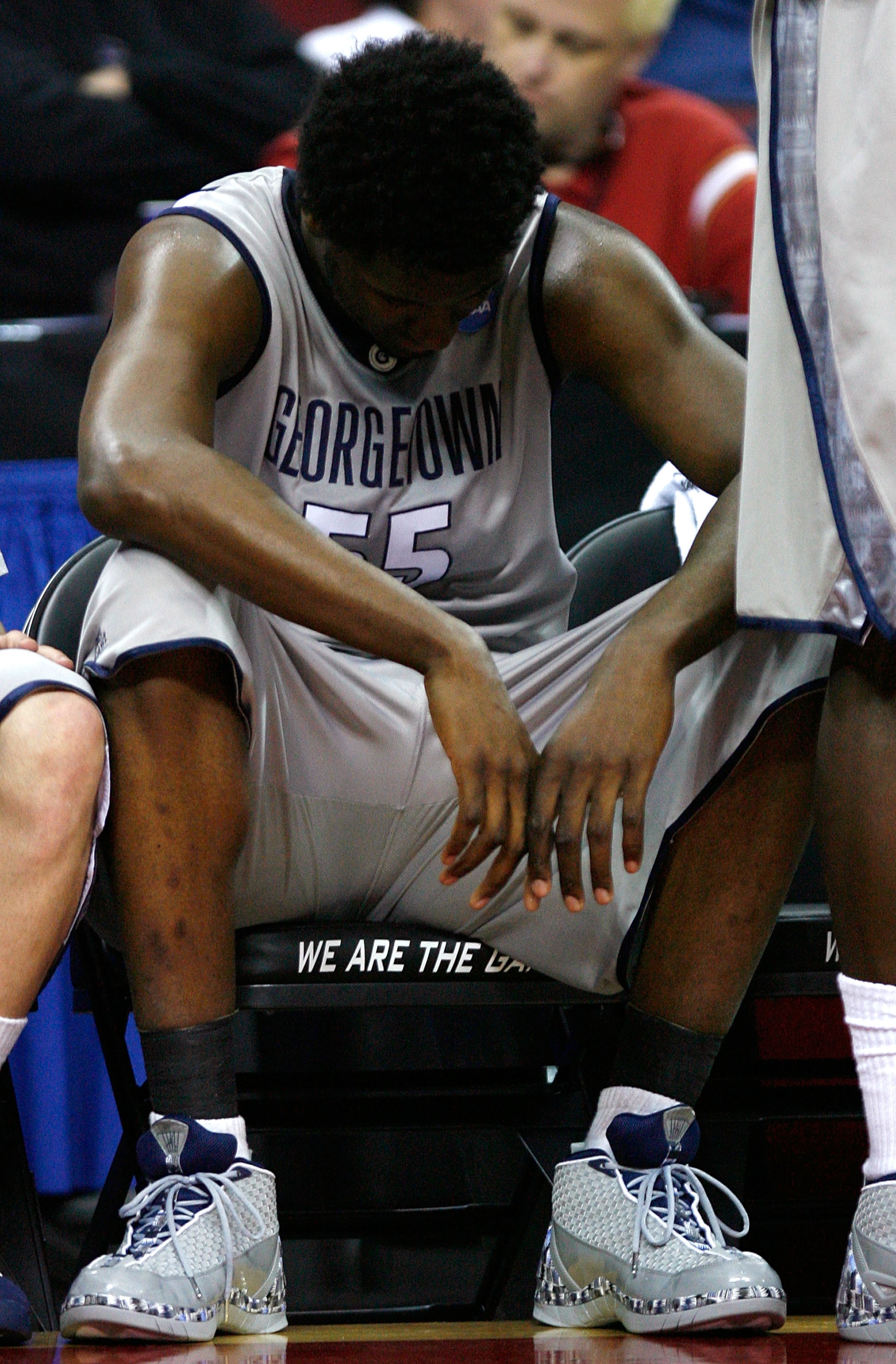 RALEIGH, NC - MARCH 23:  Roy Hibbert #55 of the Georgetown Hoyas sits dejected on the bench after fouling out against the Davidson Wildcats during the 2nd round of the 2008 NCAA Men's Basketball Tournament at RBC Center March 23, 2008 in Raleigh, North Ca