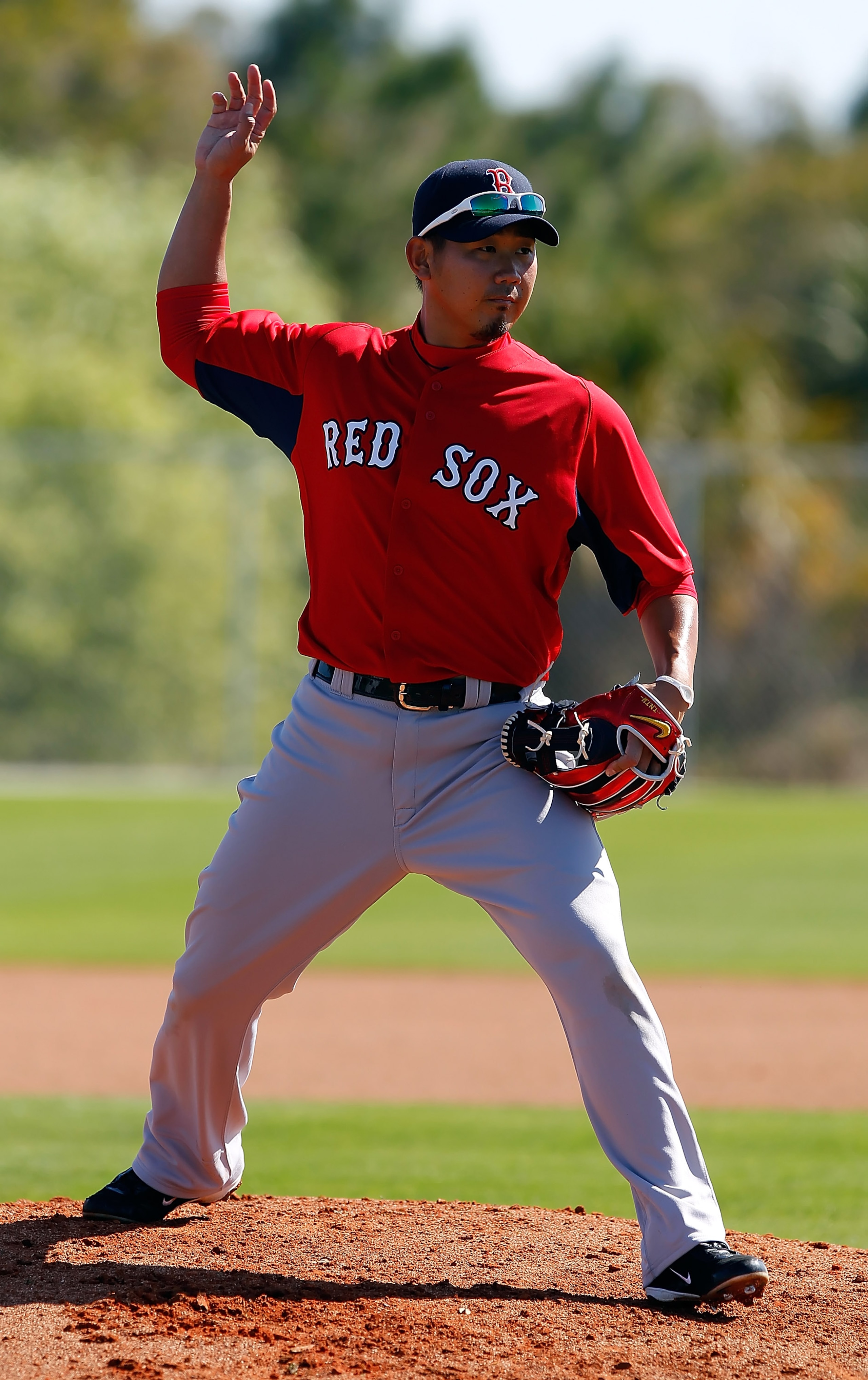 FORT MYERS, FL - FEBRUARY 19:  Pitcher Daisuke Matsuzaka #18 of the Boston Red Sox participates in a drill during a Spring Training Workout Session at the Red Sox Player Development Complex on February 19, 2011 in Fort Myers, Florida.  (Photo by J. Meric/