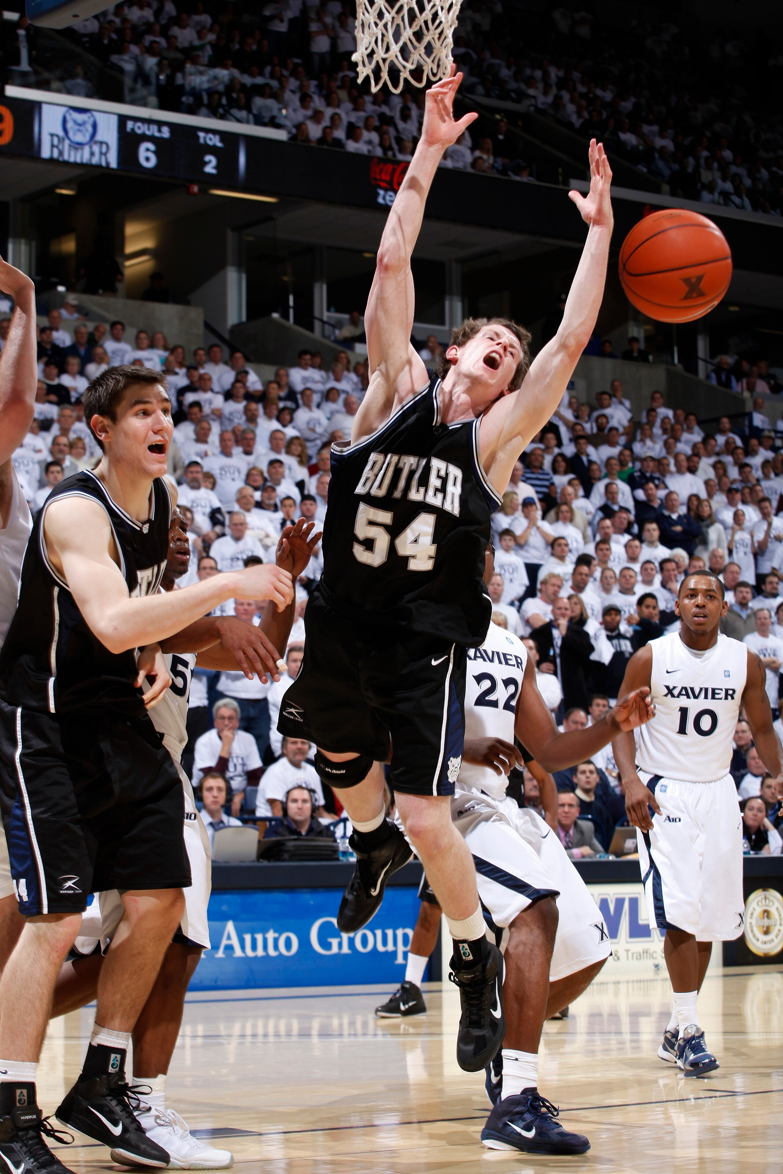 CINCINNATI, OH - DECEMBER 9: Matt Howard #54 of the Butler Bulldogs has the ball knocked away as he goes up for a shot against the Xavier Musketeers at Cintas Center on December 9, 2010 in Cincinnati, Ohio. Xavier defeated Butler 51-49. (Photo by Joe Robb