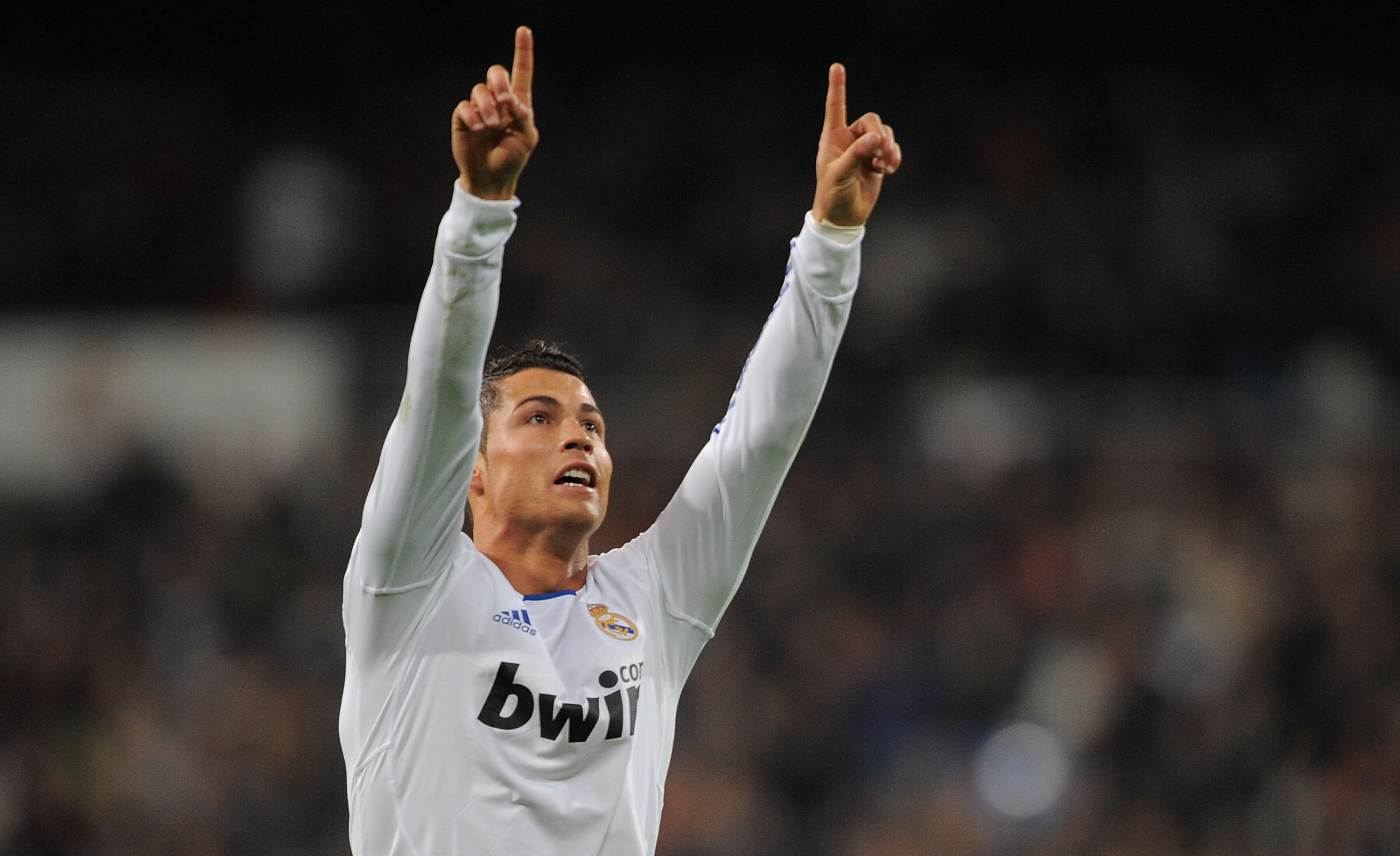MADRID, SPAIN - JANUARY 09:  Cristiano Ronaldo   of Real Madrid celebrates after scoring Real's first goal during the La Liga match between Real Madrid and Villarreal at Estadio Santiago Bernabeu on January 9, 2011 in Madrid, Spain.  (Photo by Denis Doyle