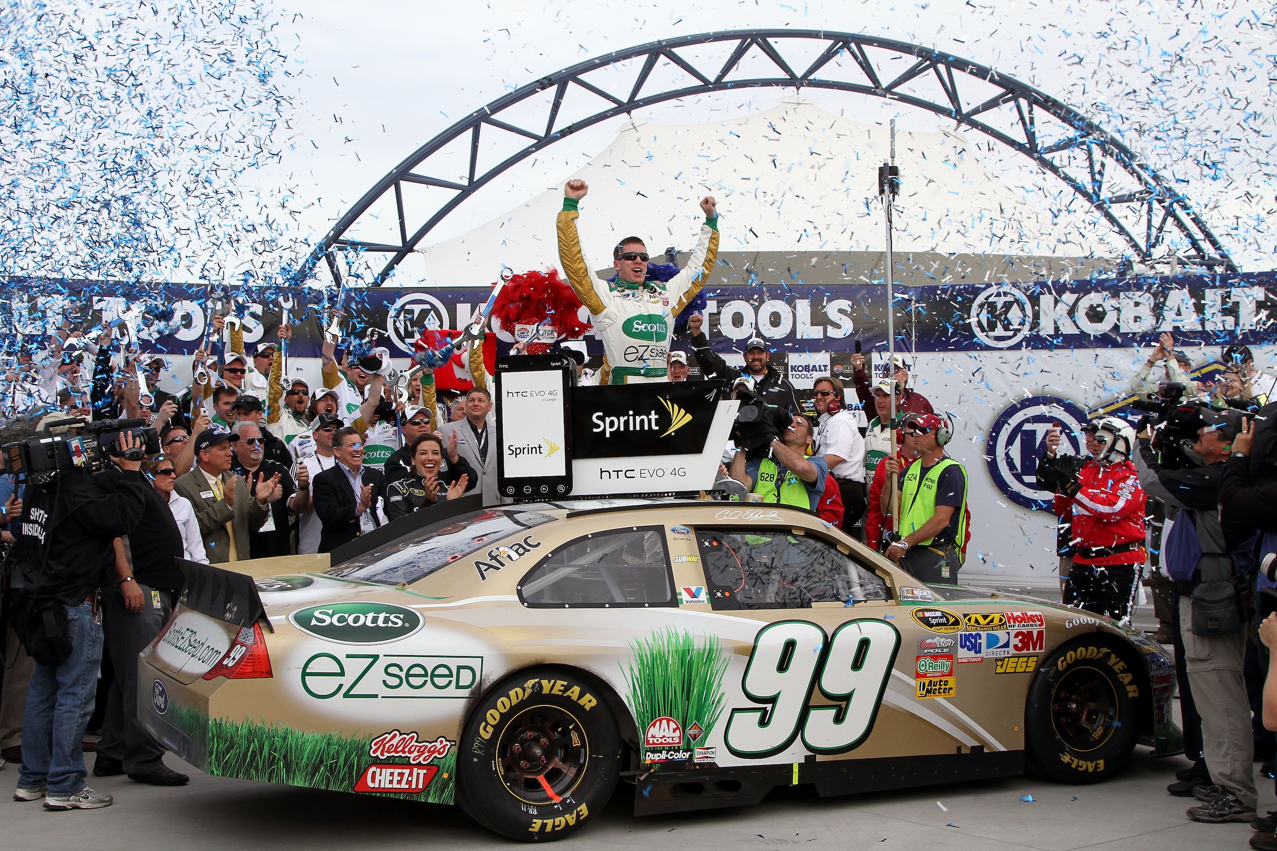LAS VEGAS, NV - MARCH 06:  Carl Edwards, driver of the #99 Scotts/Kellogg's Ford, celebrates in Victory Lane after winning the NASCAR Sprint Cup Series Kobalt Tools 400 at Las Vegas Motor Speedway on March 6, 2011 in Las Vegas, Nevada.  (Photo by Jerry Ma