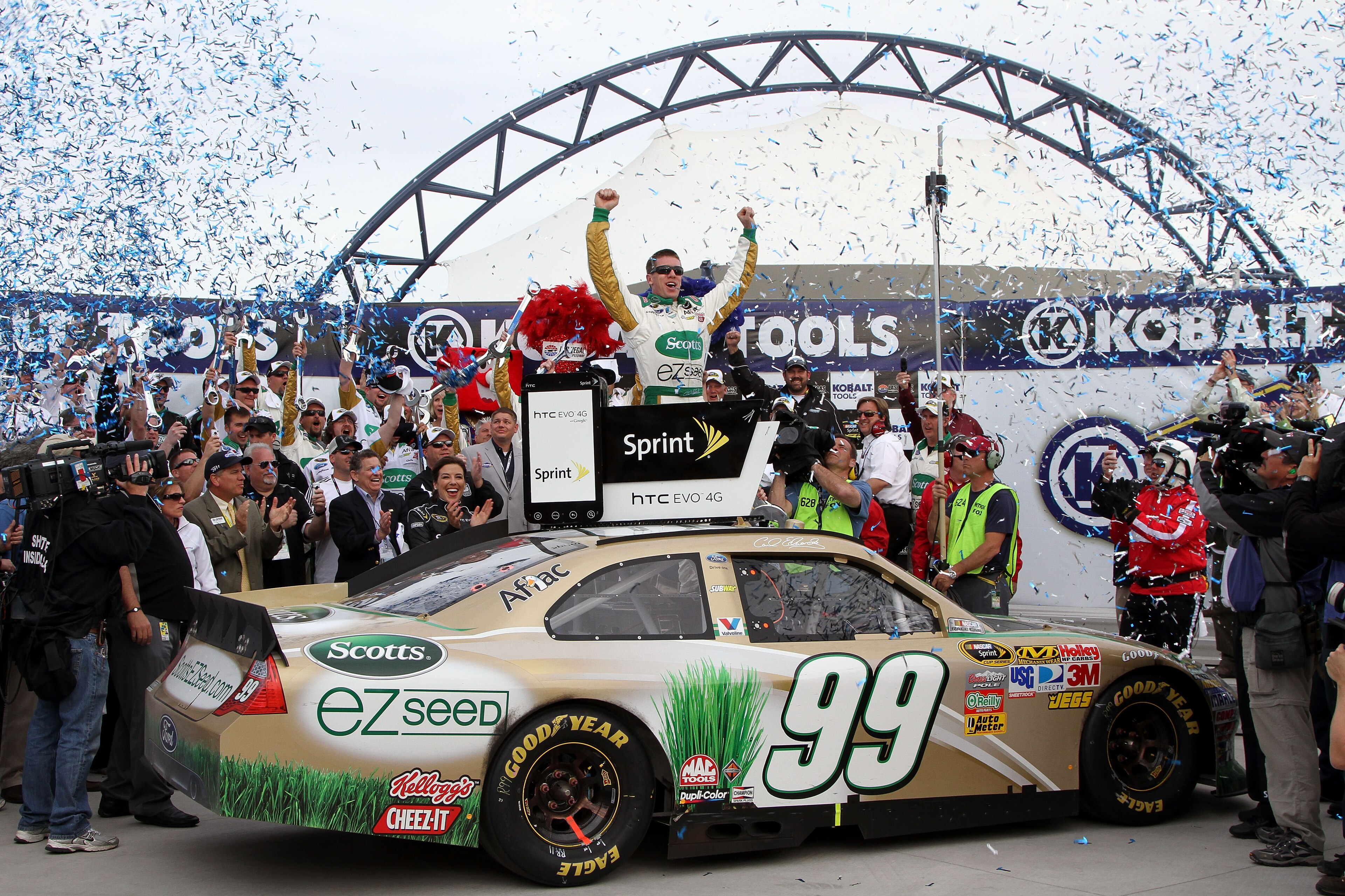 LAS VEGAS, NV - MARCH 06:  Carl Edwards, driver of the #99 Scotts/Kellogg's Ford, celebrates in Victory Lane after winning the NASCAR Sprint Cup Series Kobalt Tools 400 at Las Vegas Motor Speedway on March 6, 2011 in Las Vegas, Nevada.  (Photo by Jerry Ma