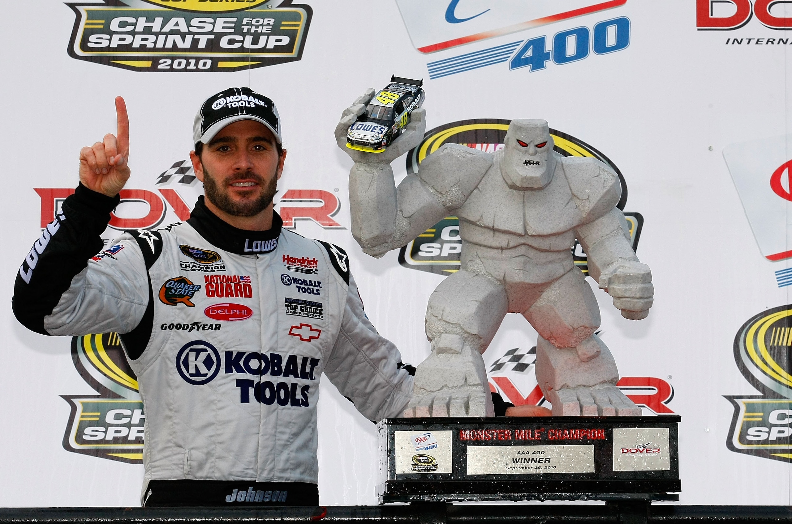 DOVER, DE - SEPTEMBER 26: Jimmie Johnson, driver of the #48 Lowe's/Kobalt Tools Chevrolet, celebrates in Victory Lane after winning the NASCAR Sprint Cup Series AAA 400 at Dover International Speedway on September 26, 2010 in Dover, Delaware.  (Photo by G