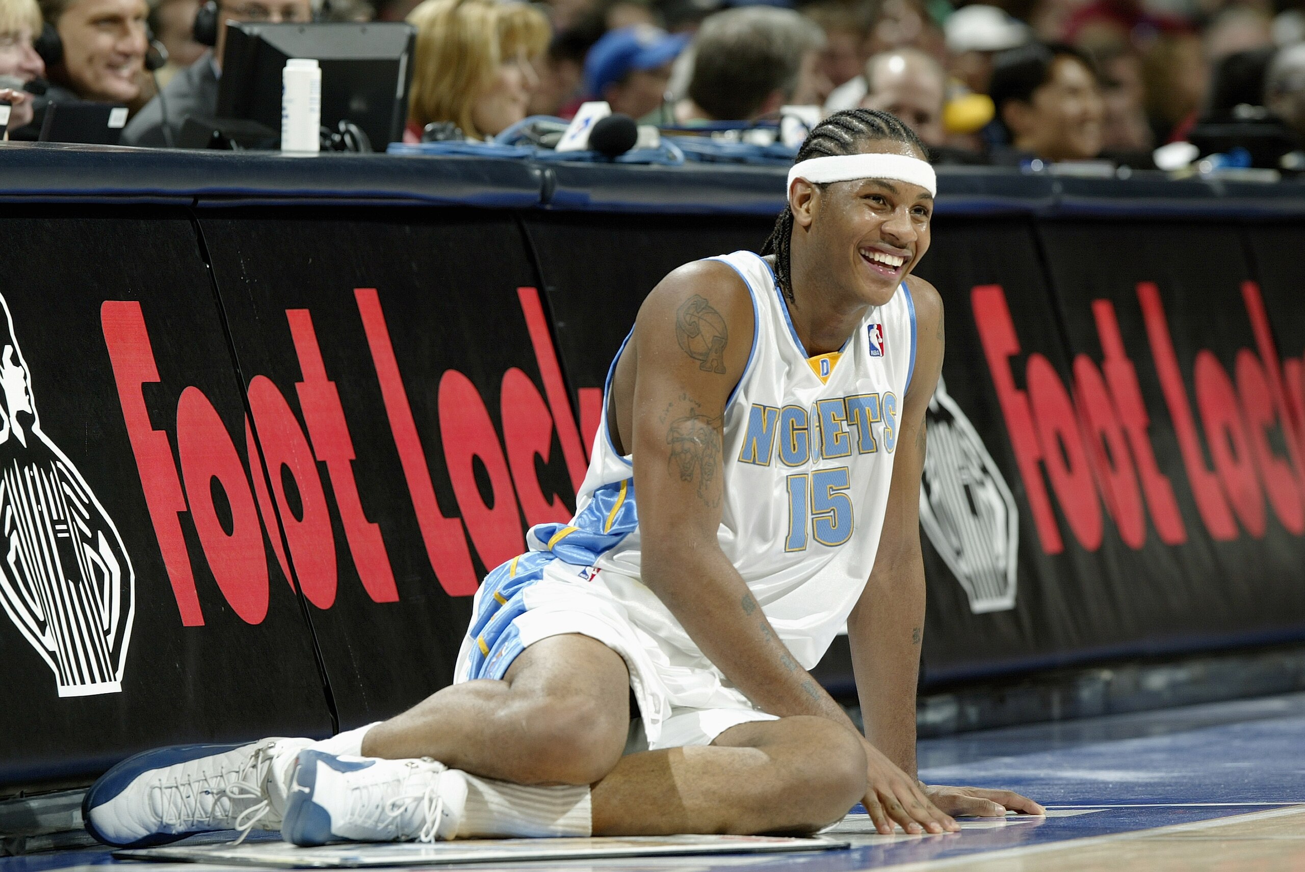 DENVER - DECEMBER 30:  Carmelo Anthony #15 of the Denver Nuggets waits to get into the game against the Toronto Raptors on December 30, 2003 at the Pepsi Center in Denver, Colorado.  The Raptors won 81-74.   NOTE TO USER:  User expressly acknowledges and