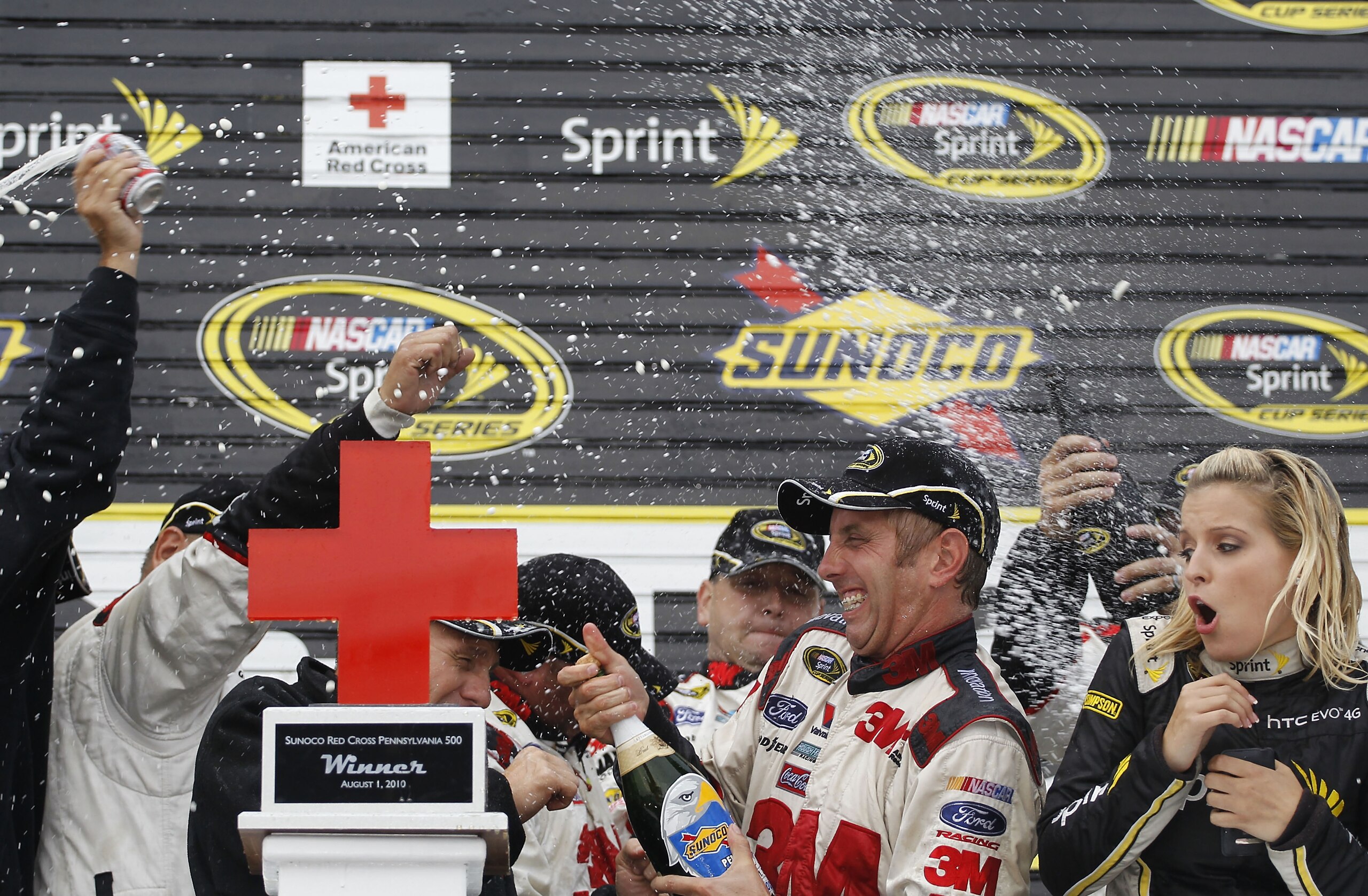 LONG POND, PA - AUGUST 01:  Greg Biffle, driver of the #16 3M Ford, celebrates in Victory Lane after winning the NASCAR Sprint Cup Series Sunoco Red Cross Pennsylvania 500 at Pocono Raceway on August 1, 2010 in Long Pond, Pennsylvania.  (Photo by Chris Tr