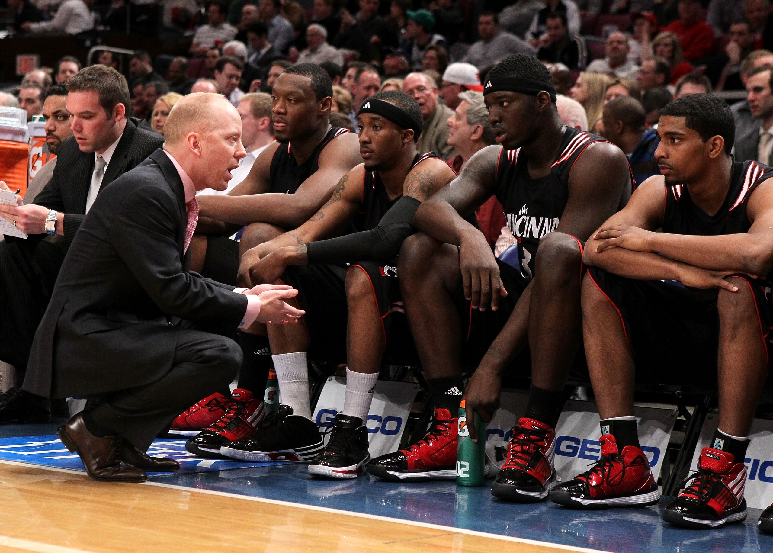 NEW YORK - MARCH 10: Head coach Mick Cronin of the Cincinnati Bearcats talks to his players against the Louisville Cardinals during the second round of 2010 NCAA Big East Tournament at Madison Square Garden on March 10, 2010 in New York City.  (Photo by J