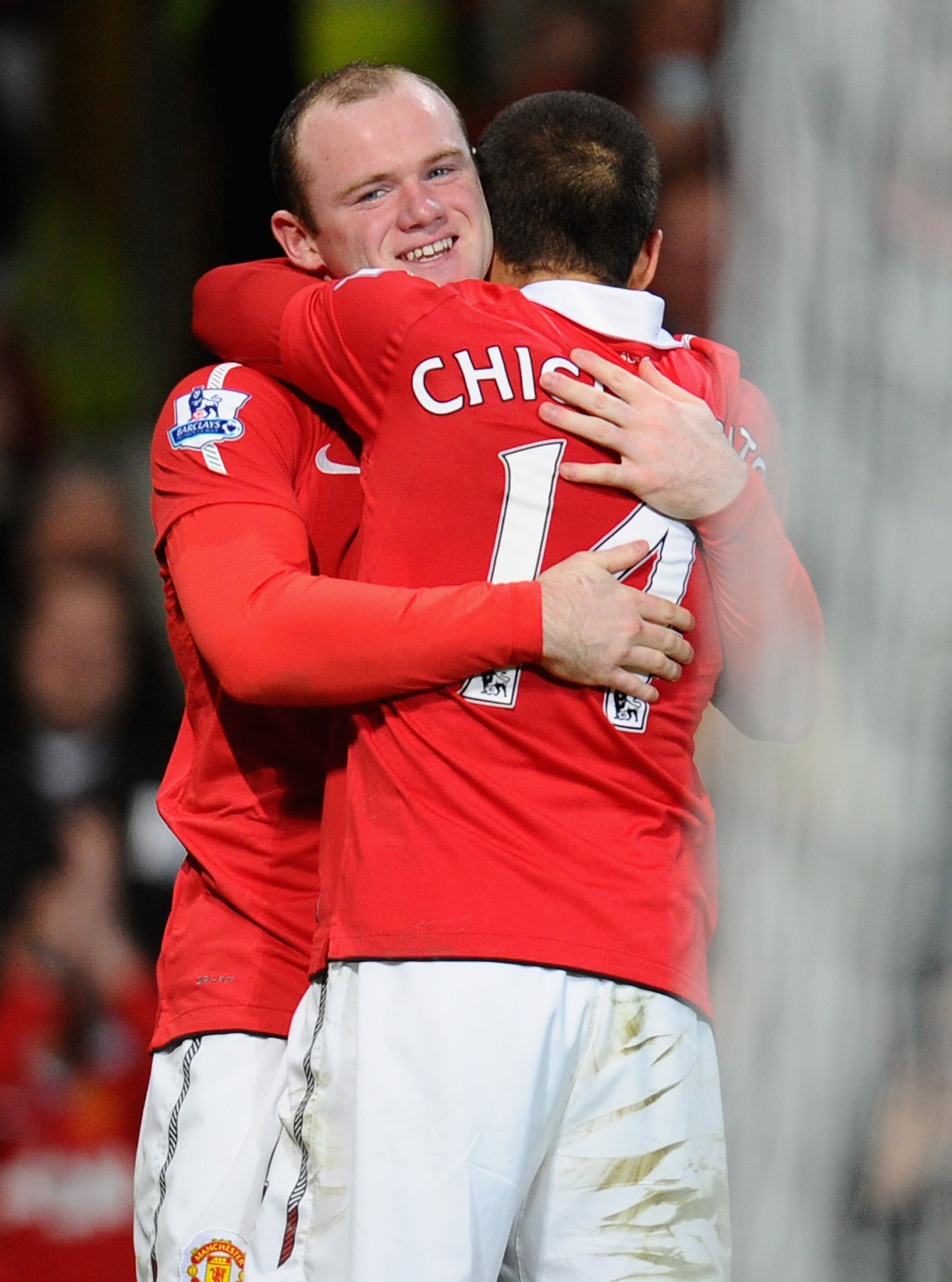 MANCHESTER, ENGLAND - MARCH 12:  Wayne Rooney of Manchester United celebrates scoring his side's second gaol with teammate Javier Hernandez during the FA Cup sponsored by E.On Sixth Round match between Manchester United and Arsenal at Old Trafford on Marc