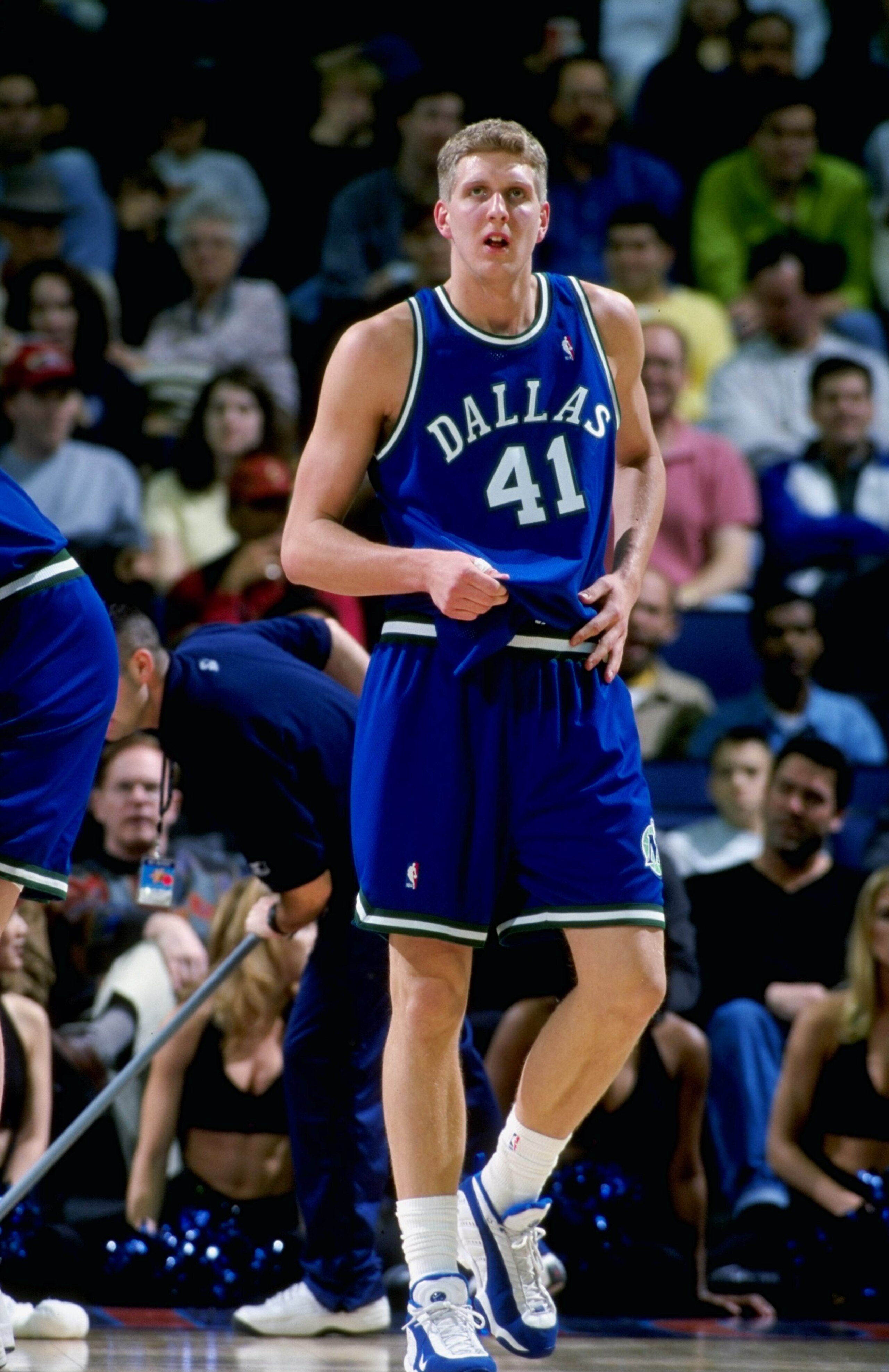 19 Feb 1999:  Dirk Nowitzki #41 of the Dallas Mavericks walks on the court during the game against the Golden State Warriors at the Oakland Coliseum in Oakland, California. The Warriors defeated the Mavericks 84-79.  Mandatory Credit: Jed Jacobsohn  /Alls