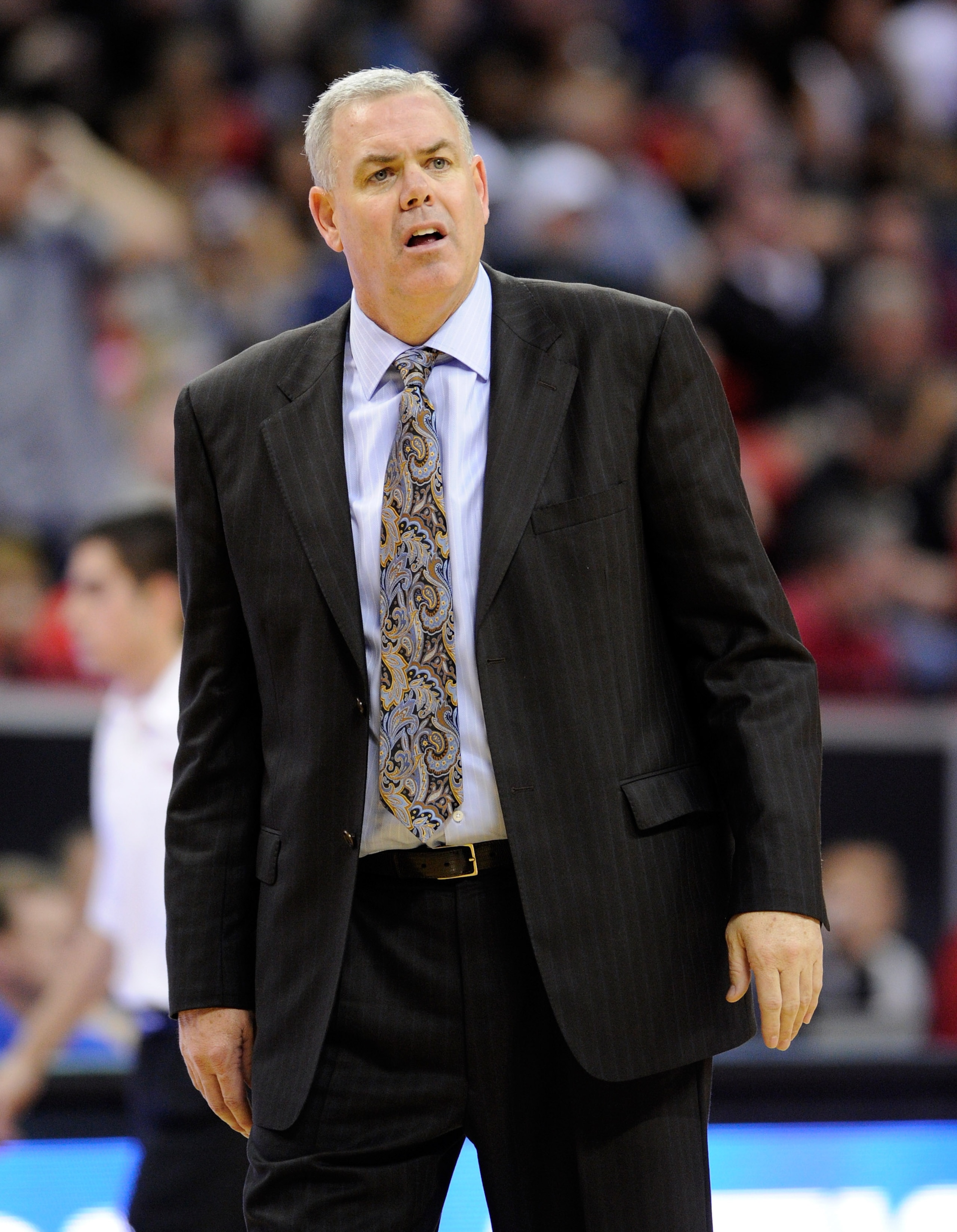 LAS VEGAS, NV - MARCH 11:  Head coach Dave Rose of the Brigham Young University Cougars questions an official's call during the team's 87-76 victory over the New Mexico Lobos in a semifinal game of the Conoco Mountain West Conference Basketball tournament