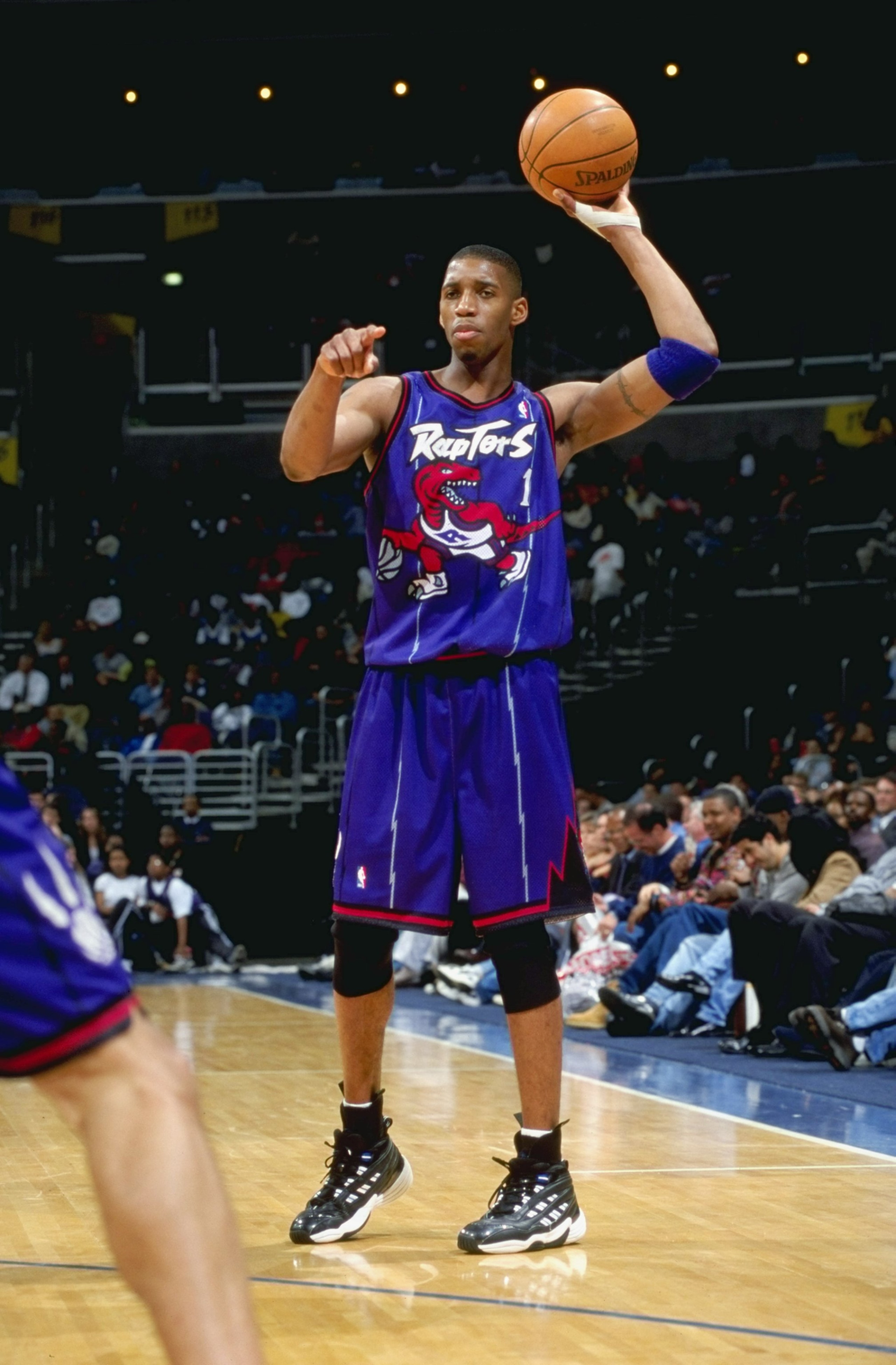 21 Apr 1999: Tracy McGrady #1 of the Toronto Raptors points as he's ready to pass the ball during the game against the Washington Wizards at the MCI Center in Washington, D.C. The Raptors defeated the Wizards 107-91.