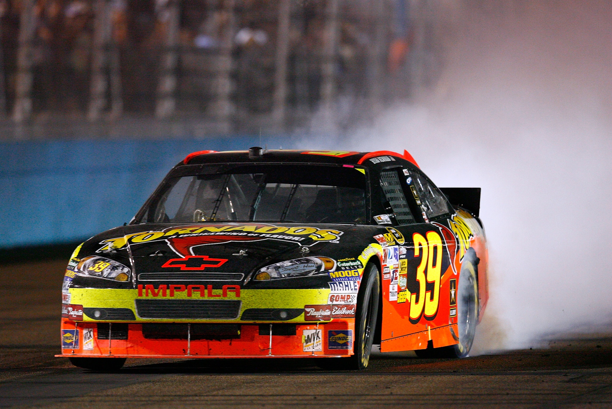 PHOENIX - APRIL 10:  Ryan Newman, driver of the #39 Tornados Chevrolet, celebrates with a burn out after winning the NASCAR Sprint Cup Series SUBWAY Fresh Fit 600 at Phoenix International Raceway on April 10, 2010 in Phoenix, Arizona.  (Photo by Tom Penni
