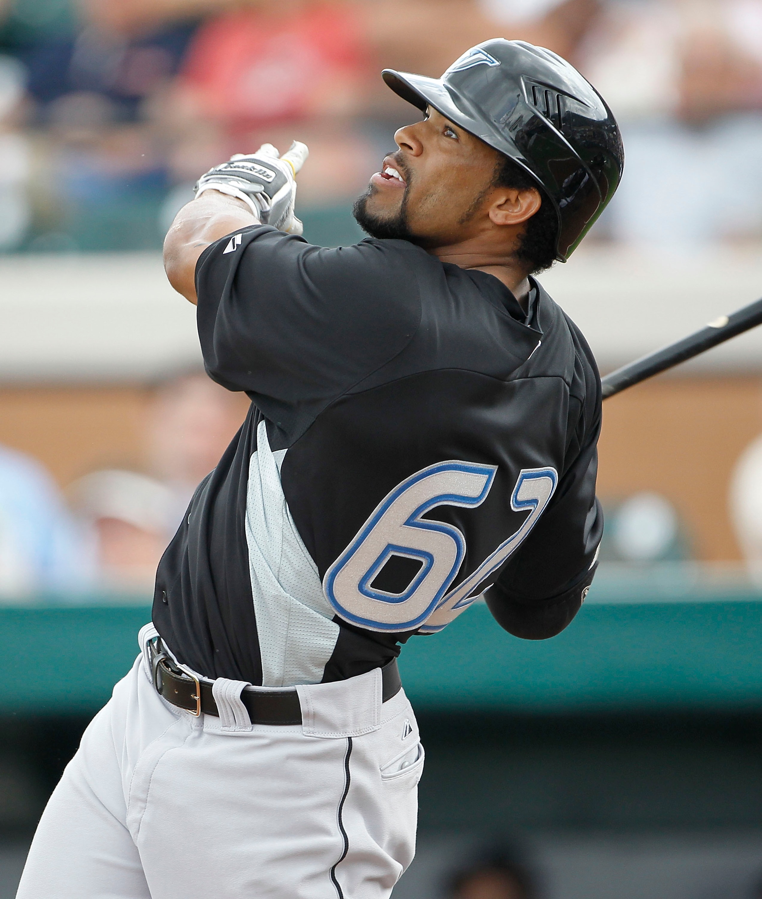 LAKELAND, FL - MARCH 01:  Eric Thames #62 of the Toronto Blue Jays watches the ball after hitting a solo home run to left field in the fourth inning during the game against the Detroit Tigers at Joker Marchant Stadium on March 1, 2011 in Lakeland, Florida