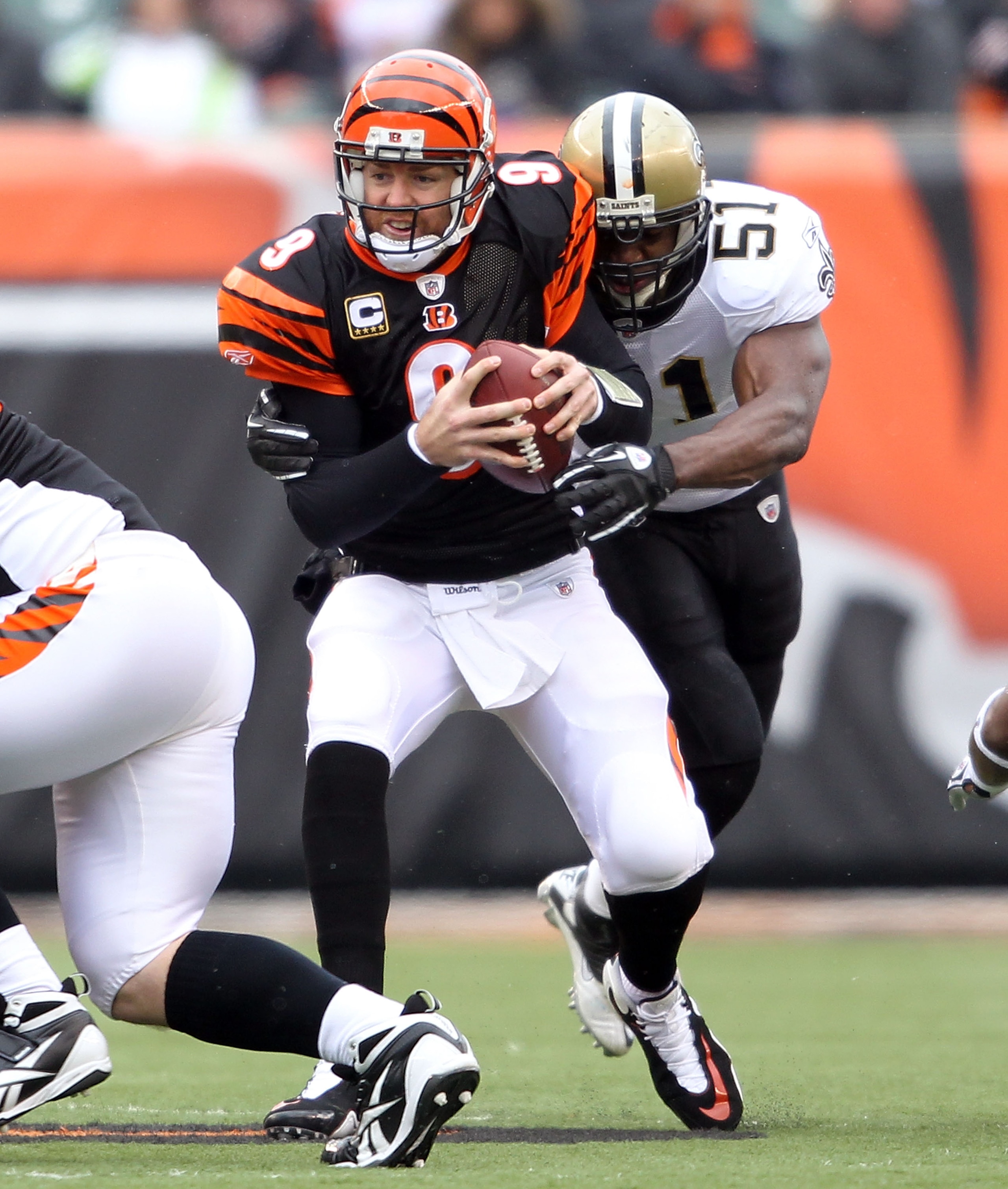 CINCINNATI, OH - DECEMBER 05:  Jonathan Vilma #51 of the New Orleans Saints sacks Carson Palmer #9 of the Cincinnati Bengals during the NFL game at Paul Brown Stadium on December 5, 2010 in Cincinnati, Ohio.  The Saints won 34-30.  (Photo by Andy Lyons/Ge