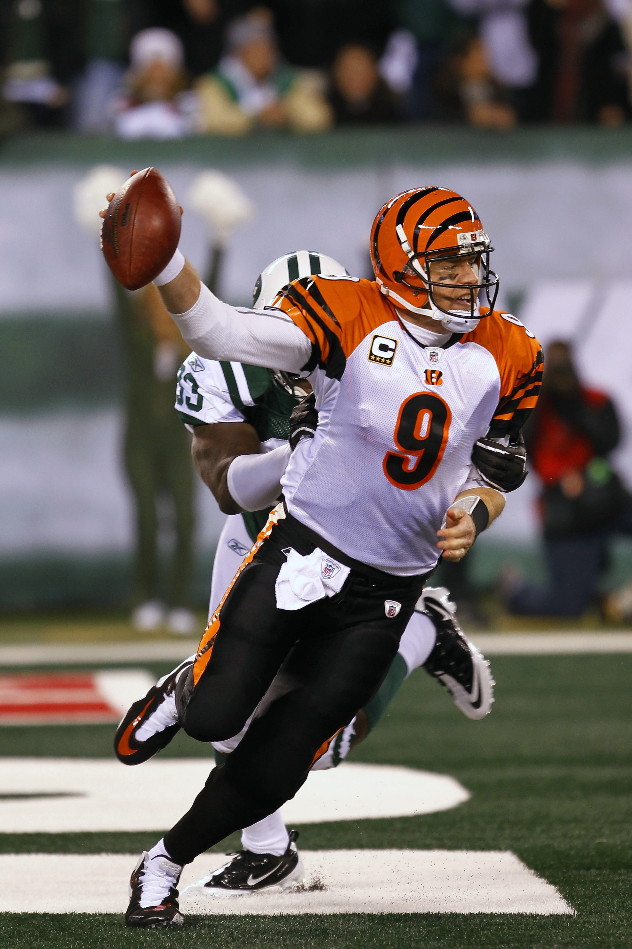EAST RUTHERFORD, NJ - NOVEMBER 25:  Quarterback Carson Palmer #9 of the Cincinnati Bengals is tackled for a safety by Trevor Pryce #93 of the New York Jets at New Meadowlands Stadium on November 25, 2010 in East Rutherford, New Jersey. The Jets defeated t