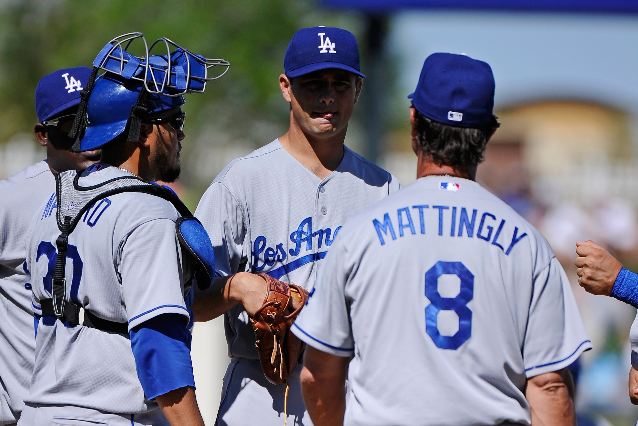 SURPRISE, AZ - MARCH 12:  Pitcher Ted Lilly #29 of the the Los Angeles Dodgers is yanked out in the third inning by manager Don Mattingly #8 during the spring training baseball game against the Kansas City Royals  at Surprise Stadium on March 12, 2011 in