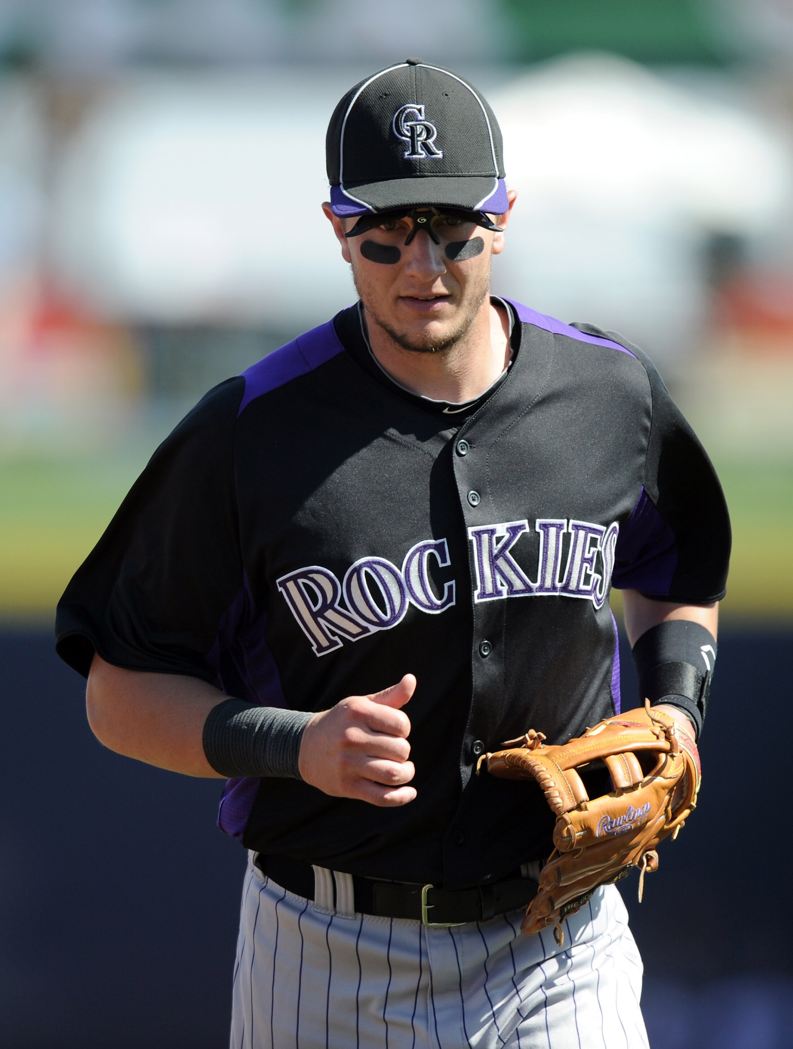 PEORIA, AZ - MARCH 02:  Troy Tulowitzki #2 of the Colorado Rockies jogs off the field against the San Diego Padres during spring training at Peoria Stadium on March 2, 2011 in Peoria, Arizona.  (Photo by Harry How/Getty Images)