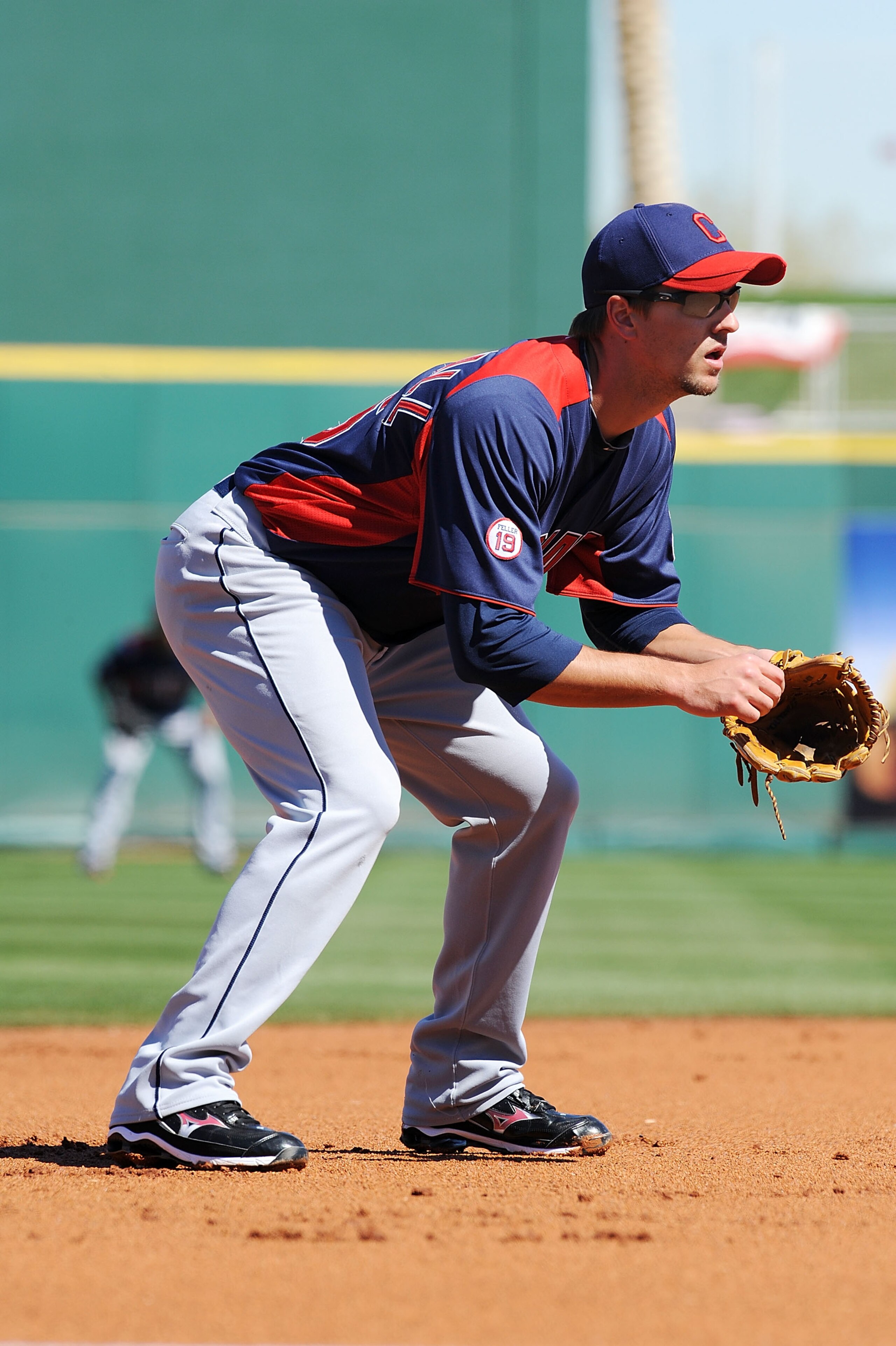 GOODYEAR, AZ - FEBRUARY 28: Lonnie Chisenhall #76 of the Cleveland Indians gets ready to make a play at third base against the Cincinnati Reds at Goodyear Ballpark on February 28, 2011 in Goodyear, Arizona. (Photo by Norm Hall/Getty Images) GOODYEAR, AZ - FEBRUARY 28: Lonnie Chisenhall #76 of the Cleveland Indians gets ready to make a play at third base against the Cincinnati Reds at Goodyear Ballpark on February 28, 2011 in Goodyear, Arizona. (Photo by Norm Hall/Getty Images)