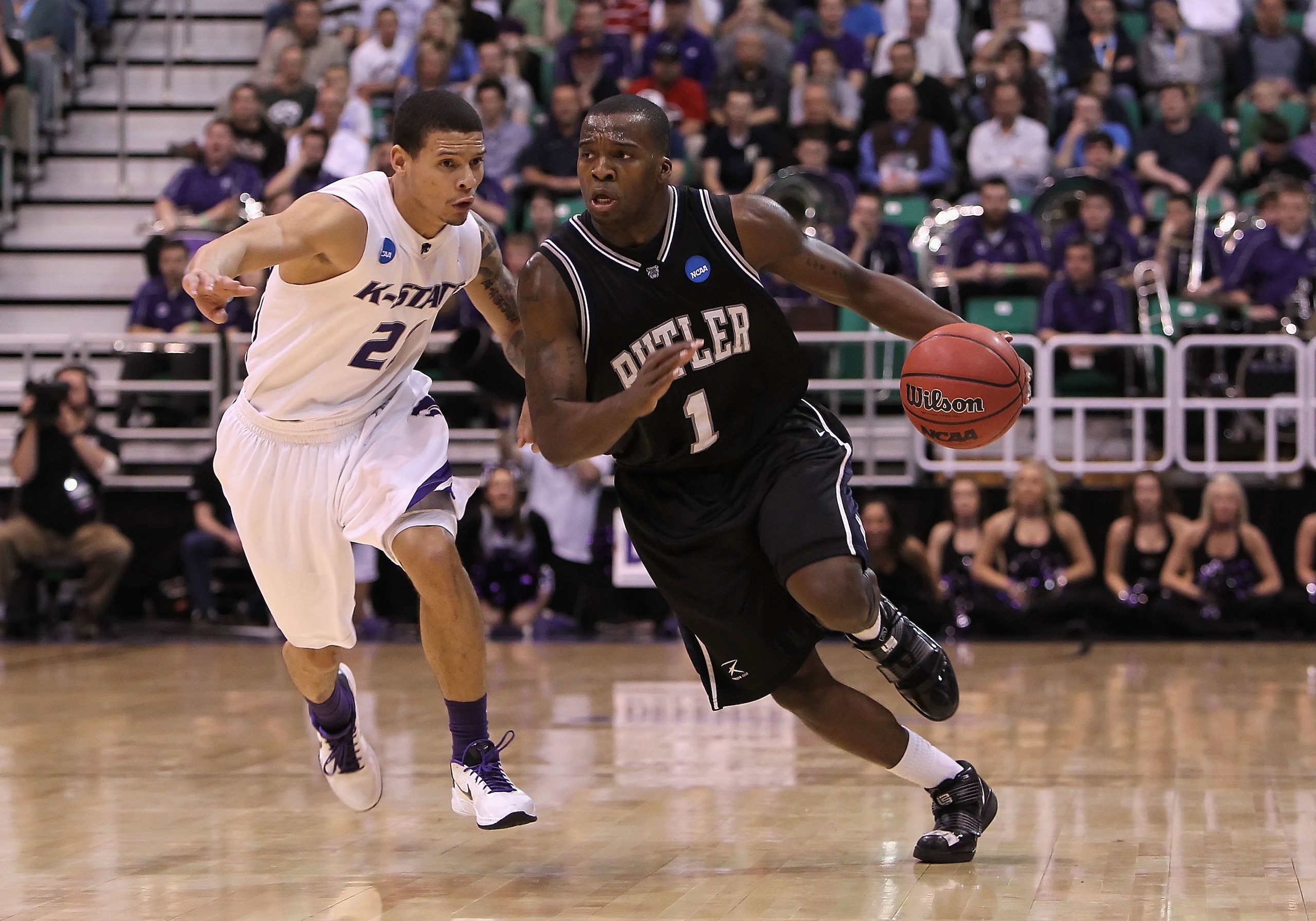 SALT LAKE CITY - MARCH 27:  Shelvin Mack #1 of the Butler Bulldogs drives the ball past Denis Clemente #21 of the Kansas State Wildcats during the west regional final of the 2010 NCAA men's basketball tournament at the Energy Solutions Arena on March 27,