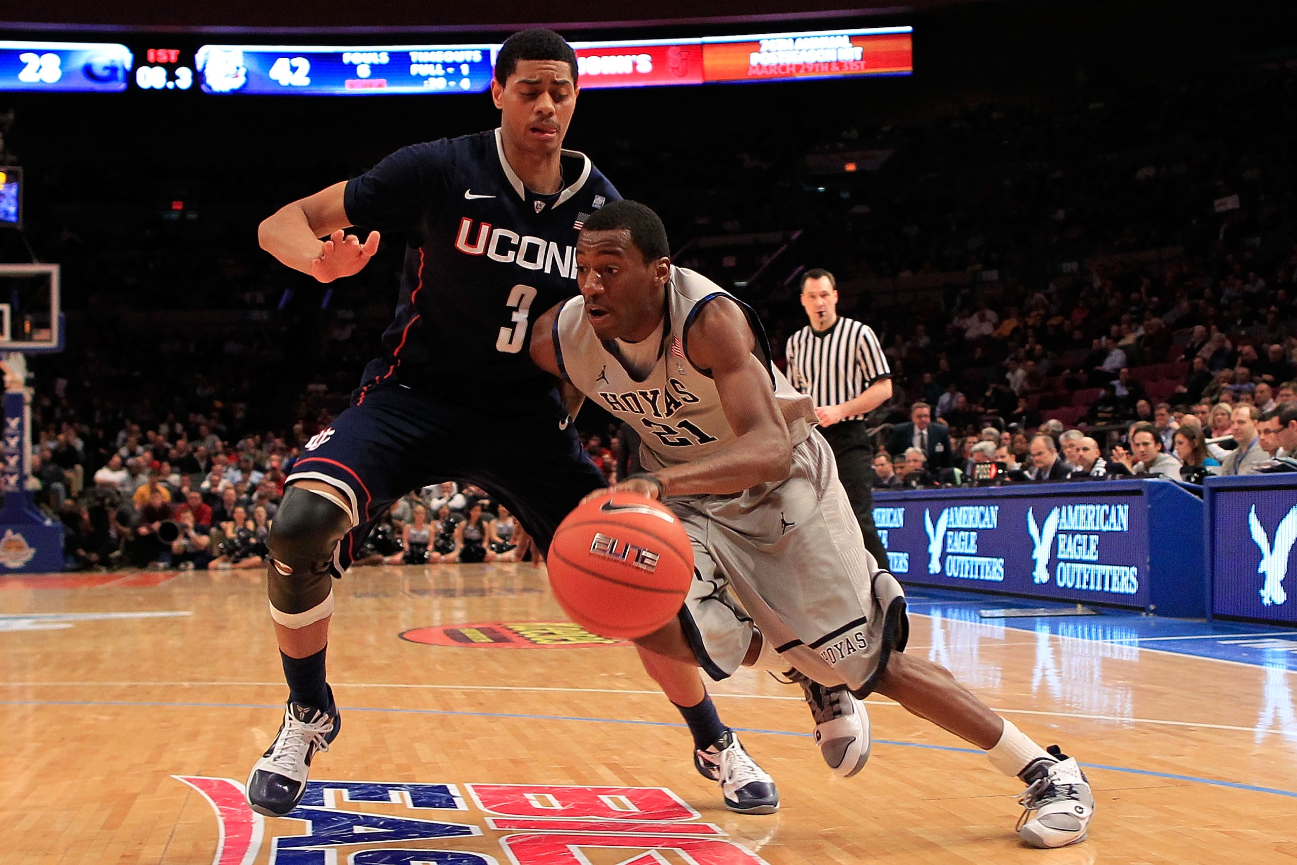NEW YORK, NY - MARCH 09:  Jason Clark #21 of the Georgetown Hoyas drives against Jeremy Lamb #3 of the Connecticut Huskies during the second round of the 2011 Big East Men's Basketball Tournament presented by American Eagle Outfitters at Madison Square Ga