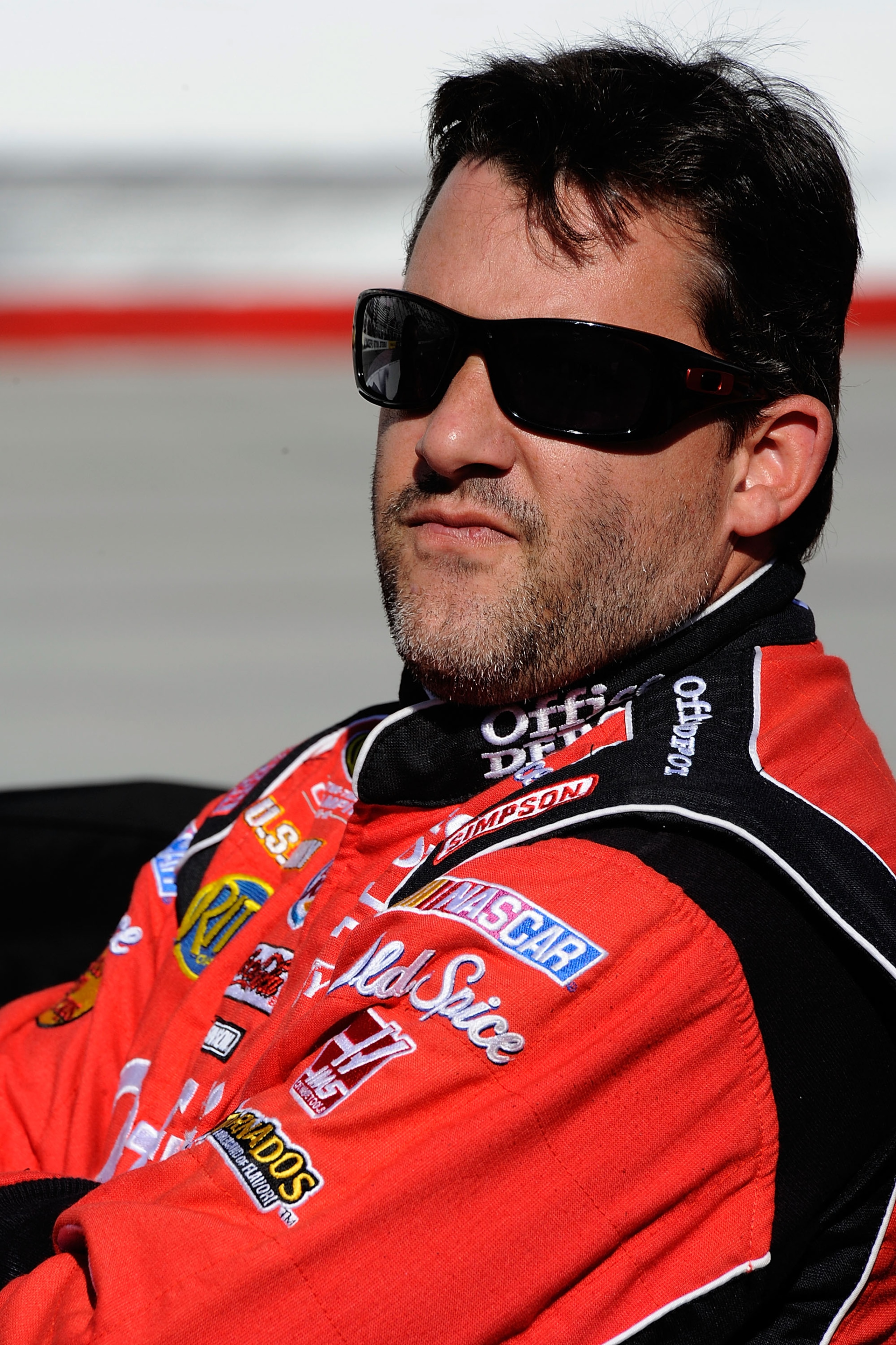 BRISTOL, TN - AUGUST 20:  Tony Stewart, driver of the #14 Office Depot/Old Spice Chevrolet, stands on the grid during qualifying for the NASCAR Sprint Cup Series IRWIN Tools Night Race at Bristol Motor Speedway on August 20, 2010 in Bristol, Tennessee.  (