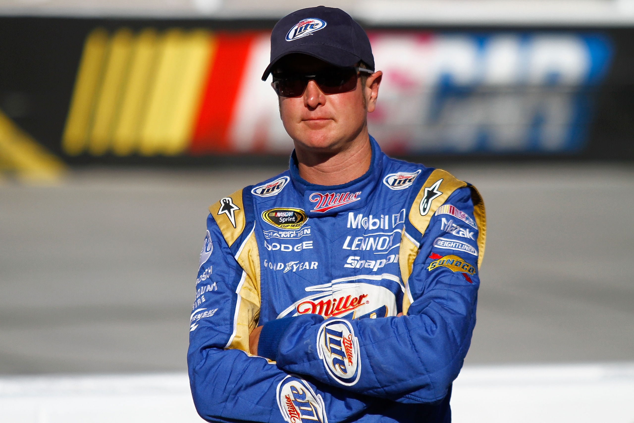 BRISTOL, TN - AUGUST 20:  Kurt Busch, driver of the #2 Miller Lite/Vortex Dodge, stands on the grid during qualifying for the NASCAR Sprint Cup Series IRWIN Tools Night Race at Bristol Motor Speedway on August 20, 2010 in Bristol, Tennessee.  (Photo by Ja