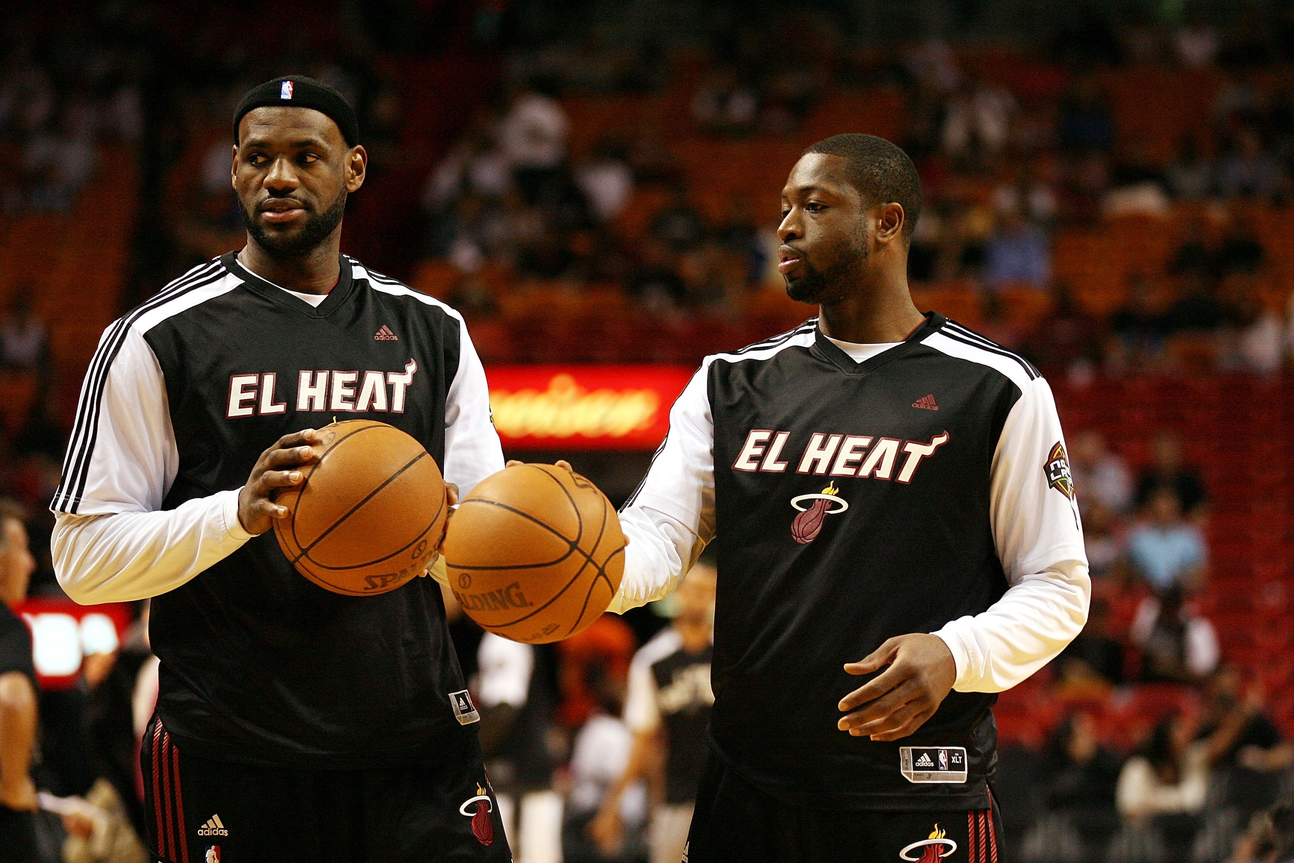 MIAMI - MARCH 14:  Forward LeBron James #6 and guard Dwyane Wade #3 of the Miami Heat  against the San Antonio Spurs at American Airlines Arena on March 14, 2011 in Miami, Florida. NOTE TO USER: User expressly acknowledges and agrees that, by downloading