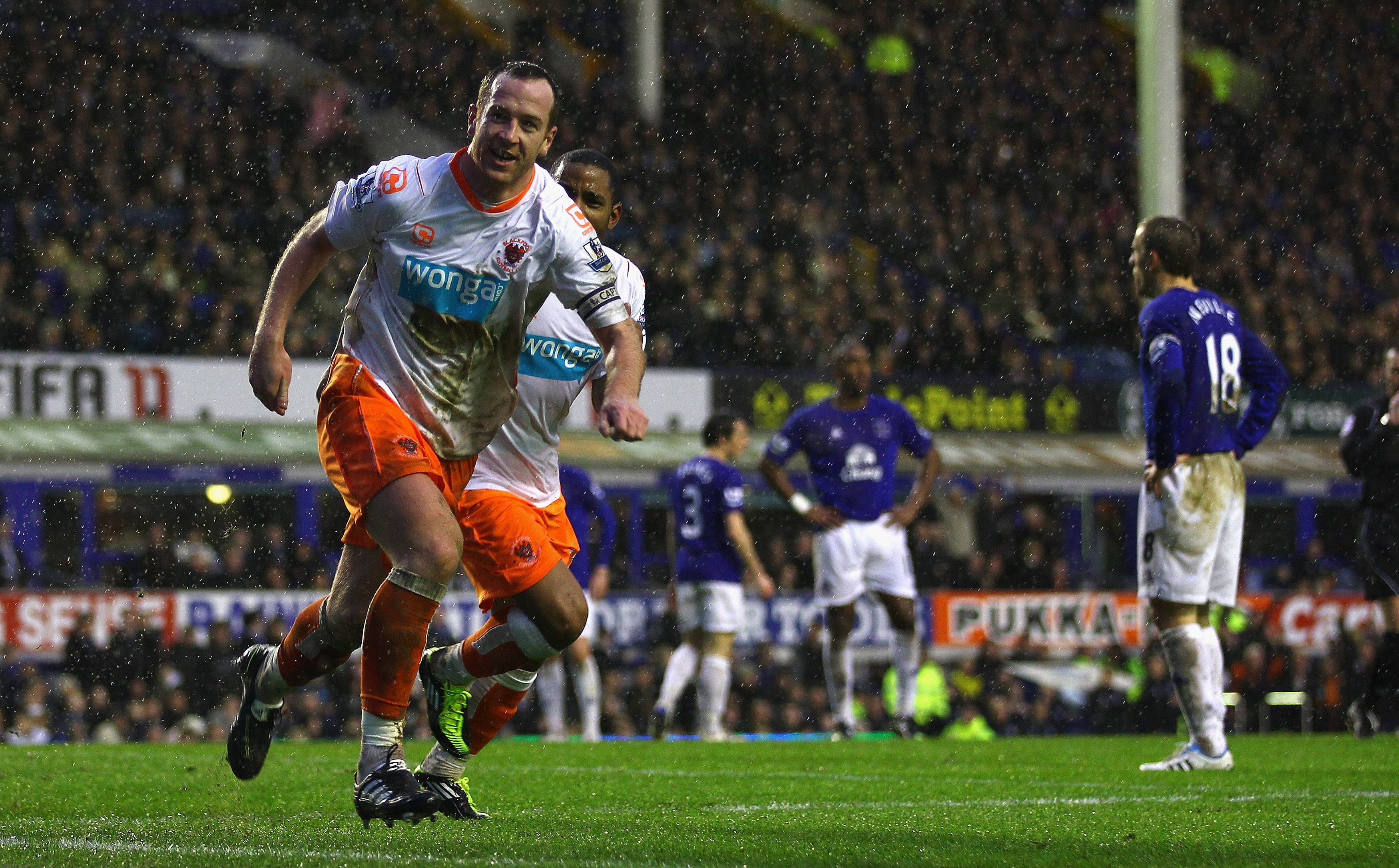 LIVERPOOL, ENGLAND - FEBRUARY 05:  Charlie Adam of Blackpool celebrates after scoring his teams third goal during the Barclays Premier League match between Everton and Blackpool at Goodison Park on February 5, 2011 in Liverpool, England.  (Photo by Clive