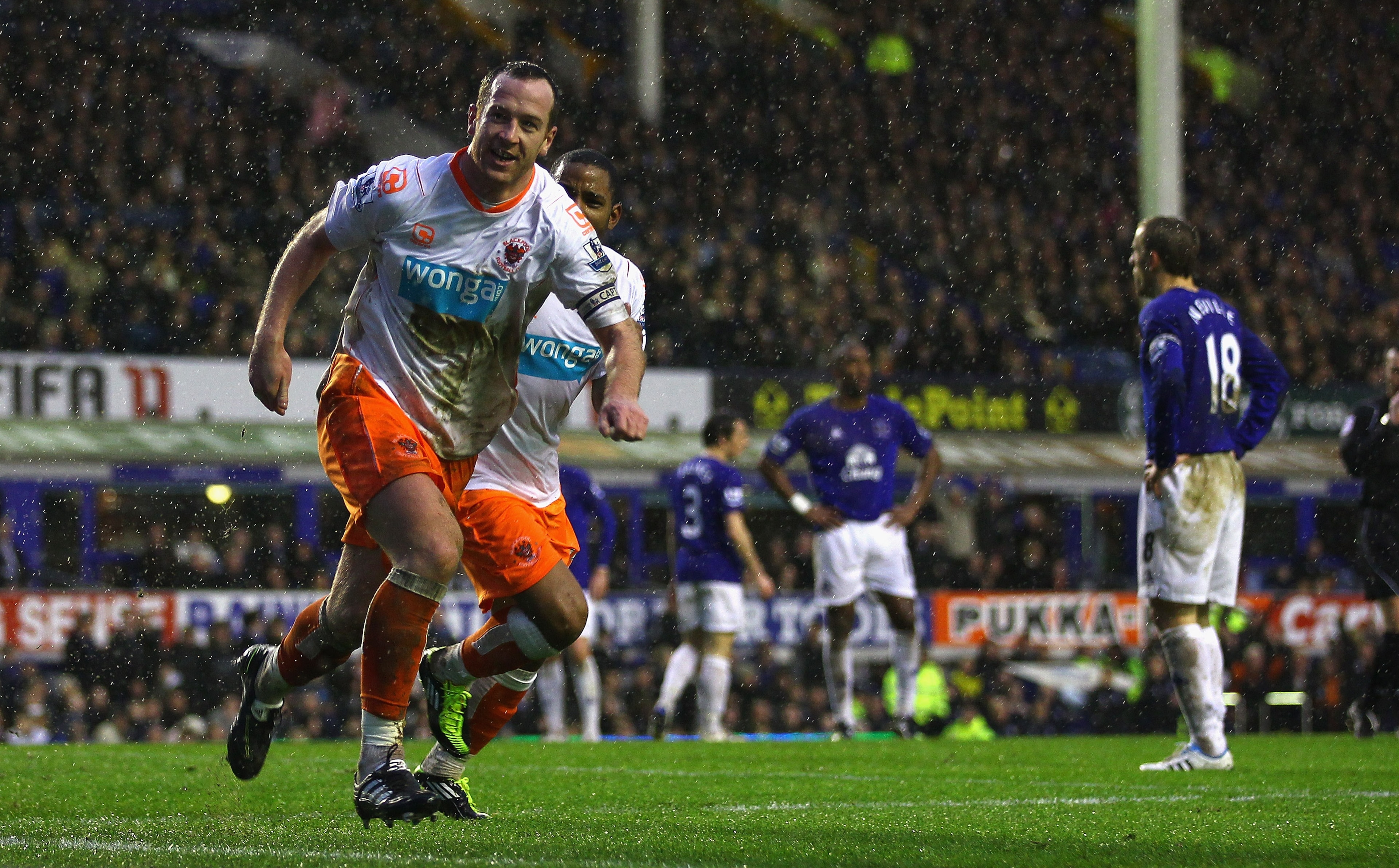 LIVERPOOL, ENGLAND - FEBRUARY 05:  Charlie Adam of Blackpool celebrates after scoring his teams third goal during the Barclays Premier League match between Everton and Blackpool at Goodison Park on February 5, 2011 in Liverpool, England.  (Photo by Clive