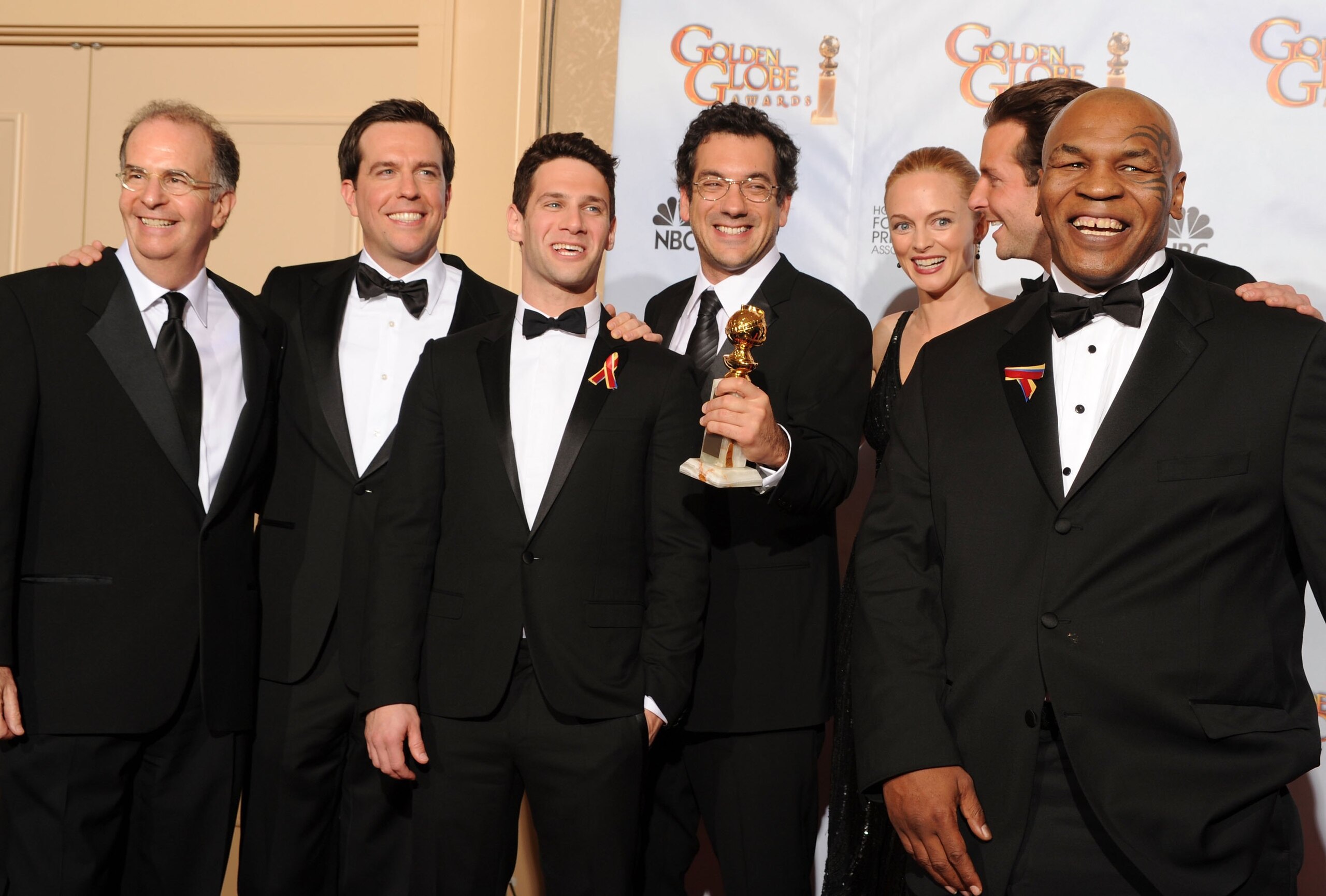 BEVERLY HILLS, CA - JANUARY 17:  (L-R) Actors Ed Helms, Justin Bartha, director Todd Phillips, actress Heather Graham, actor Bradley Cooper and former heavyweight boxer Mike Tyson pose in the press room with the Best Motion Picture Comedy or Musical award