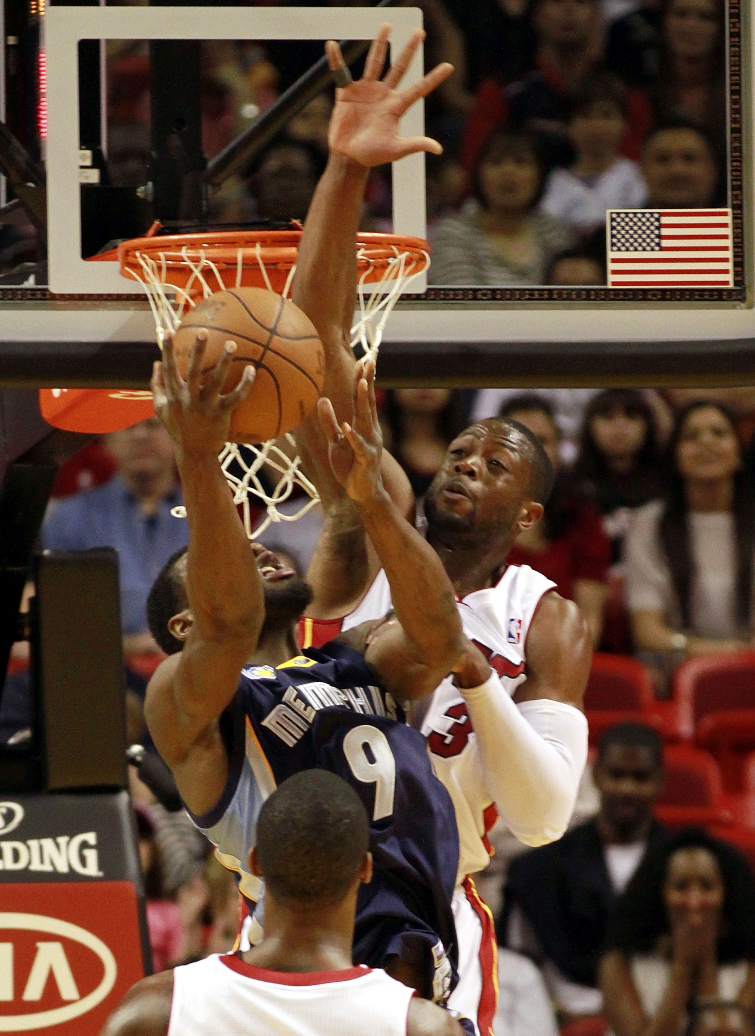 MIAMI - MARCH 12:  Guard Dwyane Wade #3 of the Miami Heat blocks a shot against Tony Allen #9 of the Memphis Grizzlies at American Airlines Arena on March 12, 2011 in Miami, Florida. NOTE TO USER: User expressly acknowledges and agrees that, by downloadin
