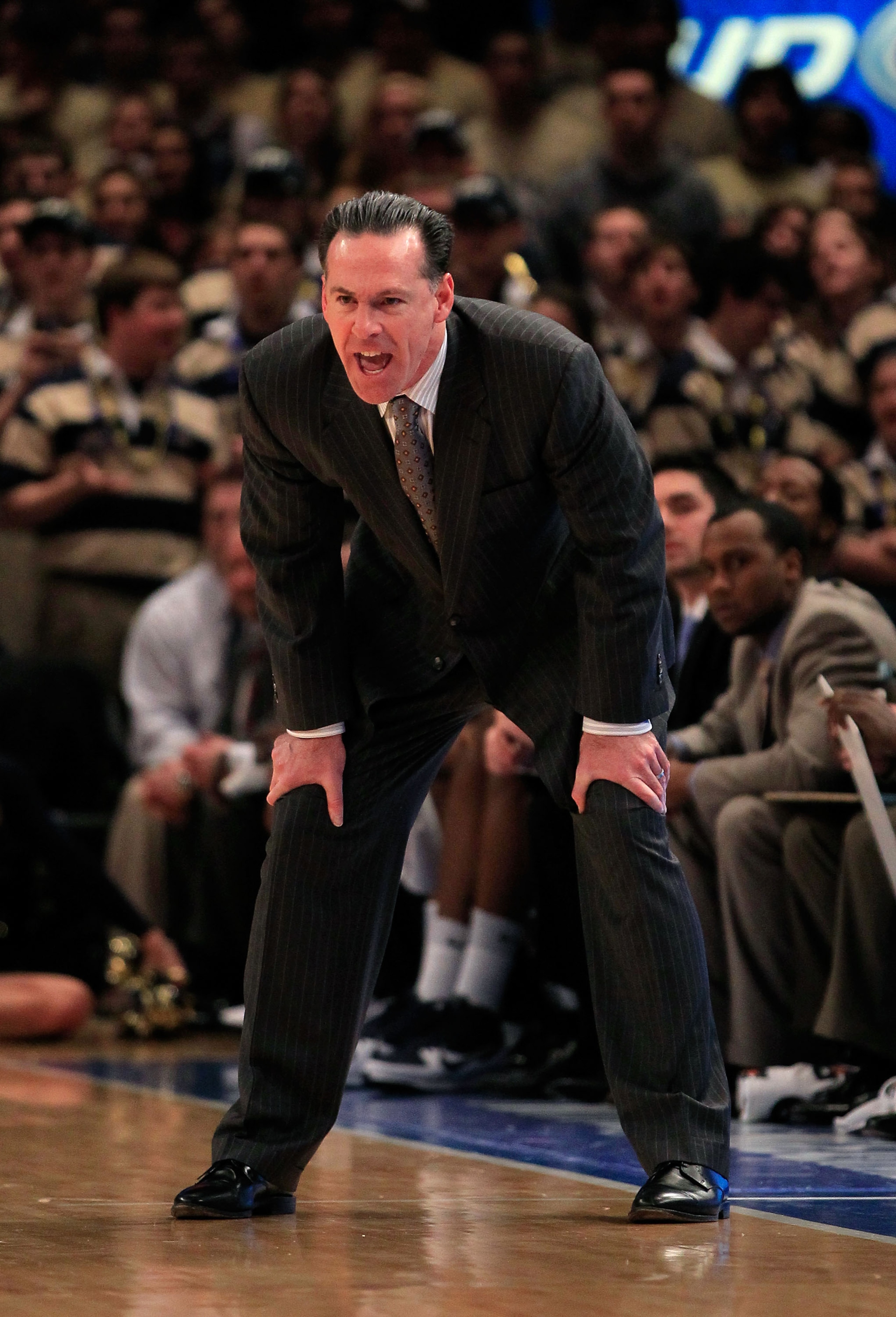 NEW YORK, NY - MARCH 10: head coach Jamie Dixon of the Pittsburgh Panthers looks on from the bench against the Connecticut Huskies during the quarterfinals of the 2011 Big East Men's Basketball Tournament presented by American Eagle Outfitters at Madison NEW YORK, NY - MARCH 10: head coach Jamie Dixon of the Pittsburgh Panthers looks on from the bench against the Connecticut Huskies during the quarterfinals of the 2011 Big East Men's Basketball Tournament presented by American Eagle Outfitters at Madison