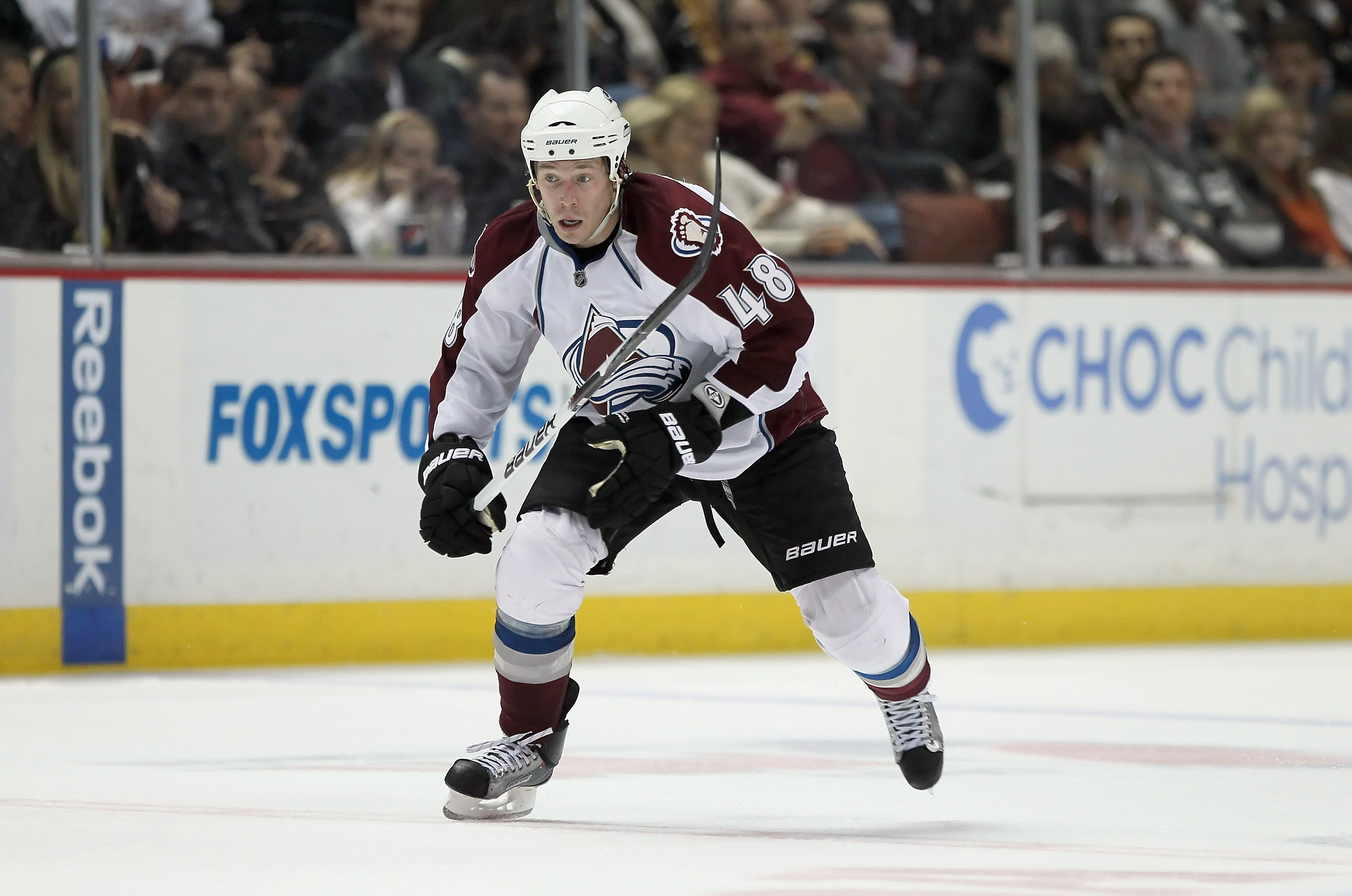 Colorado Avalanche defenseman John-Michael Liles models the new Avalanche  Reebok designed uniform against the background of past uniforms during a  press conference at the Pepsi Center in Denver on September 12, 2007.