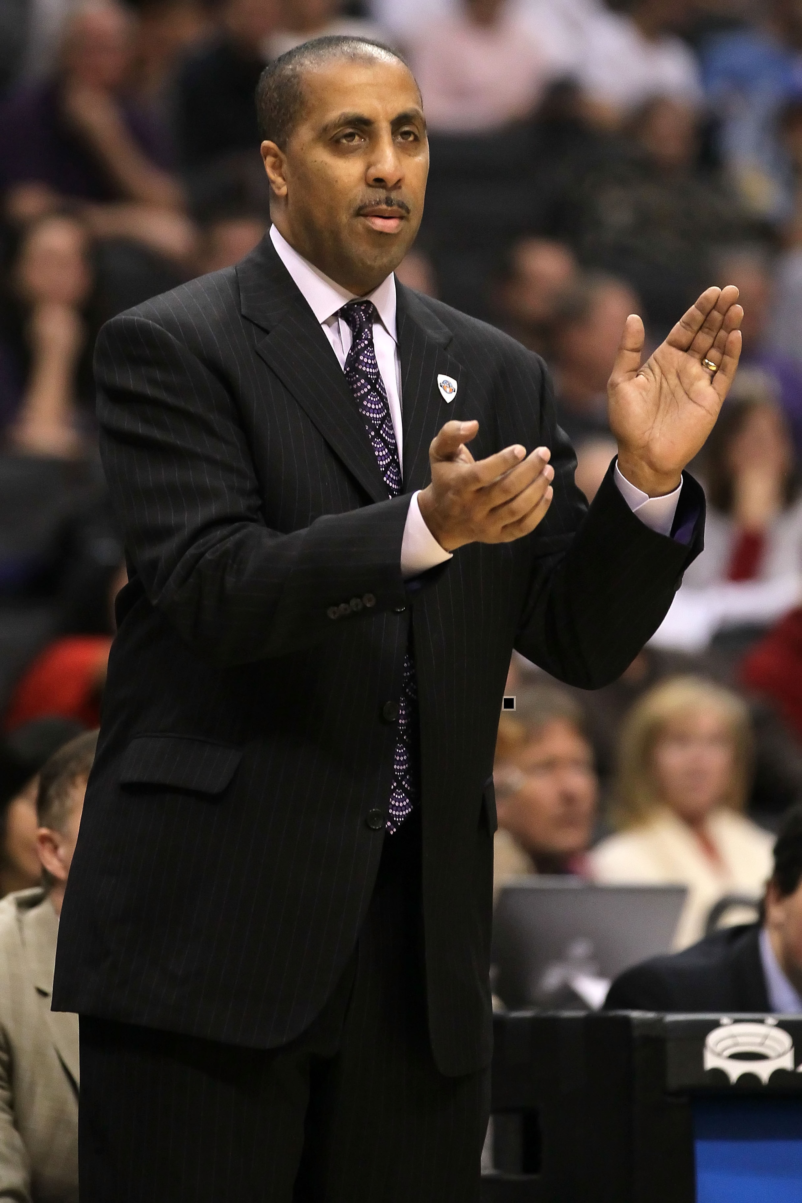LOS ANGELES, CA - MARCH 12:  Head coach Lorenzo Romar of the Washington Huskies reacts while taking on the Arizona Wildcats in the championship game of the 2011 Pacific Life Pac-10 Men's Basketball Tournament at Staples Center on March 12, 2011 in Los Ang