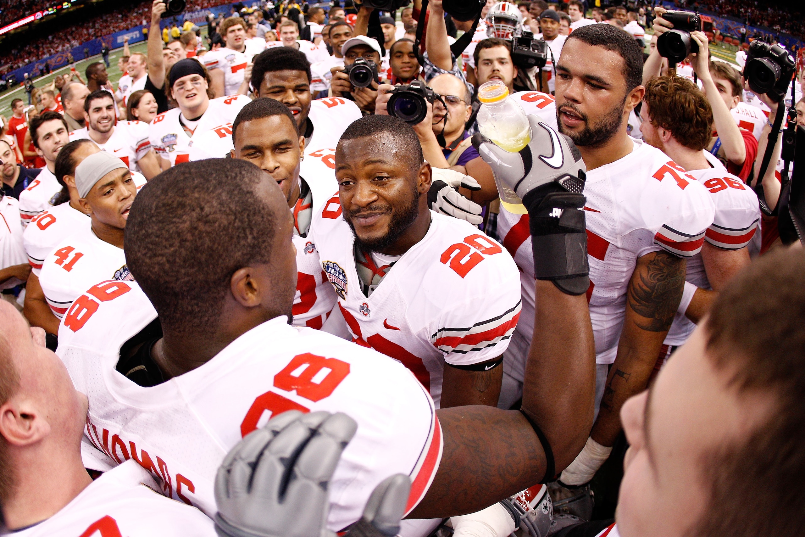 NEW ORLEANS, LA - JANUARY 04:  (L) Solomon Thomas #98 of the Ohio State Buckeyes celebrates with his teammates after he intercepts a pass to seal the 31-26 victory for the Buckeyes against the Arkansas Razorbacks in the Allstate Sugar Bowl at the Louisian
