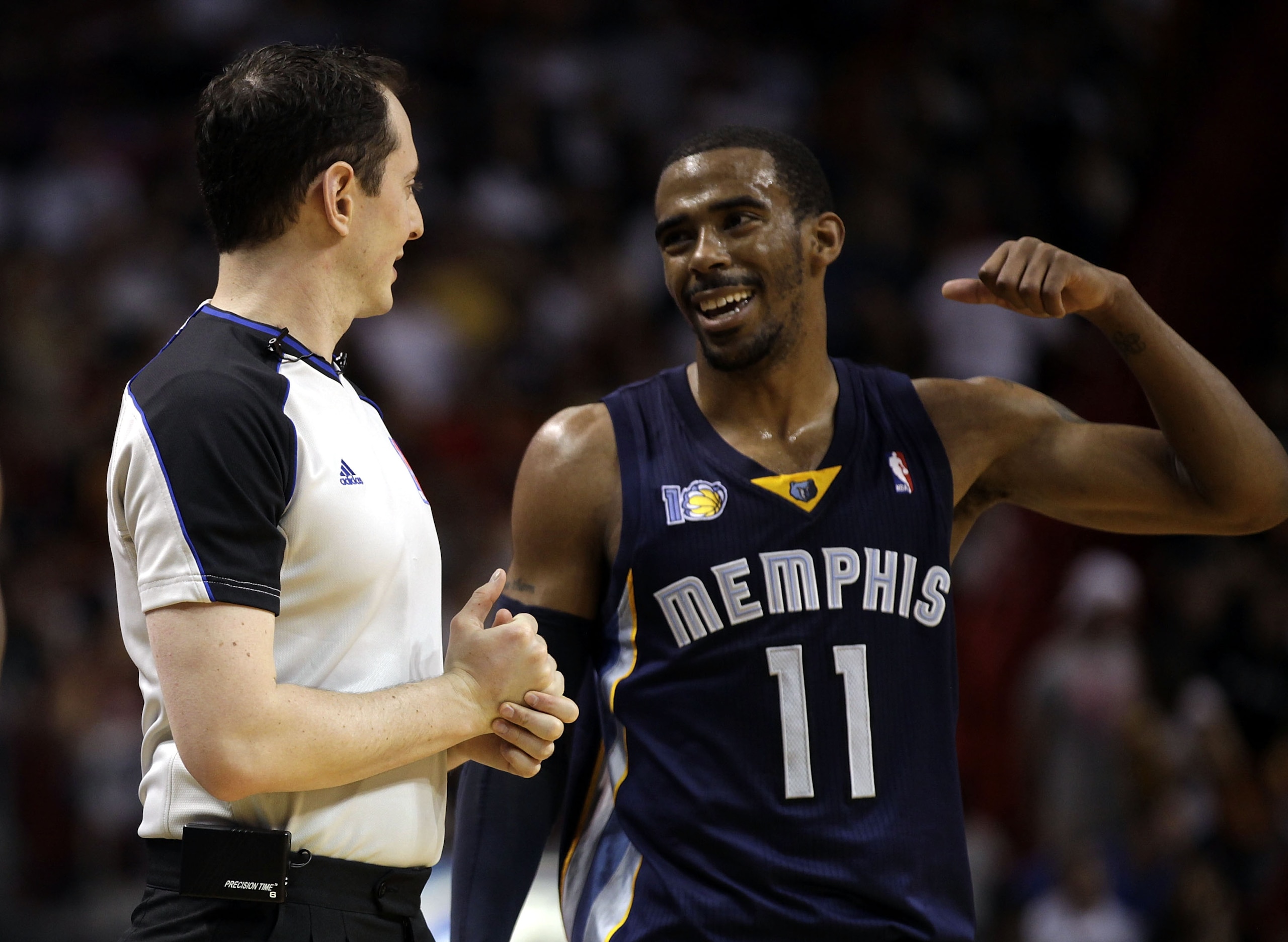 MIAMI - MARCH 12:  Guard Mike Conley #11 of the Memphis Grizzlie chats with the referee against the Miami Heat at American Airlines Arena on March 12, 2011 in Miami, Florida. NOTE TO USER: User expressly acknowledges and agrees that, by downloading and/or