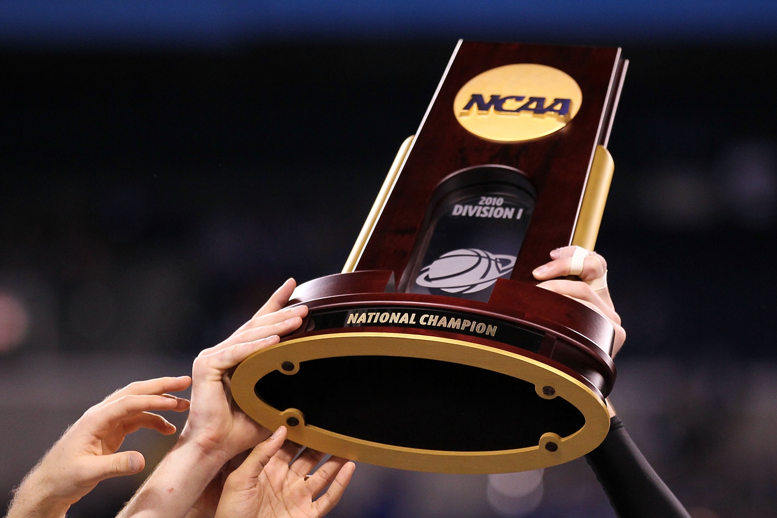 INDIANAPOLIS - APRIL 05:  The Duke Blue Devils hold up the national championship trophy as they celebrate after their 61-59 win against the Butler Bulldogs during the 2010 NCAA Division I Men's Basketball National Championship game at Lucas Oil Stadium on