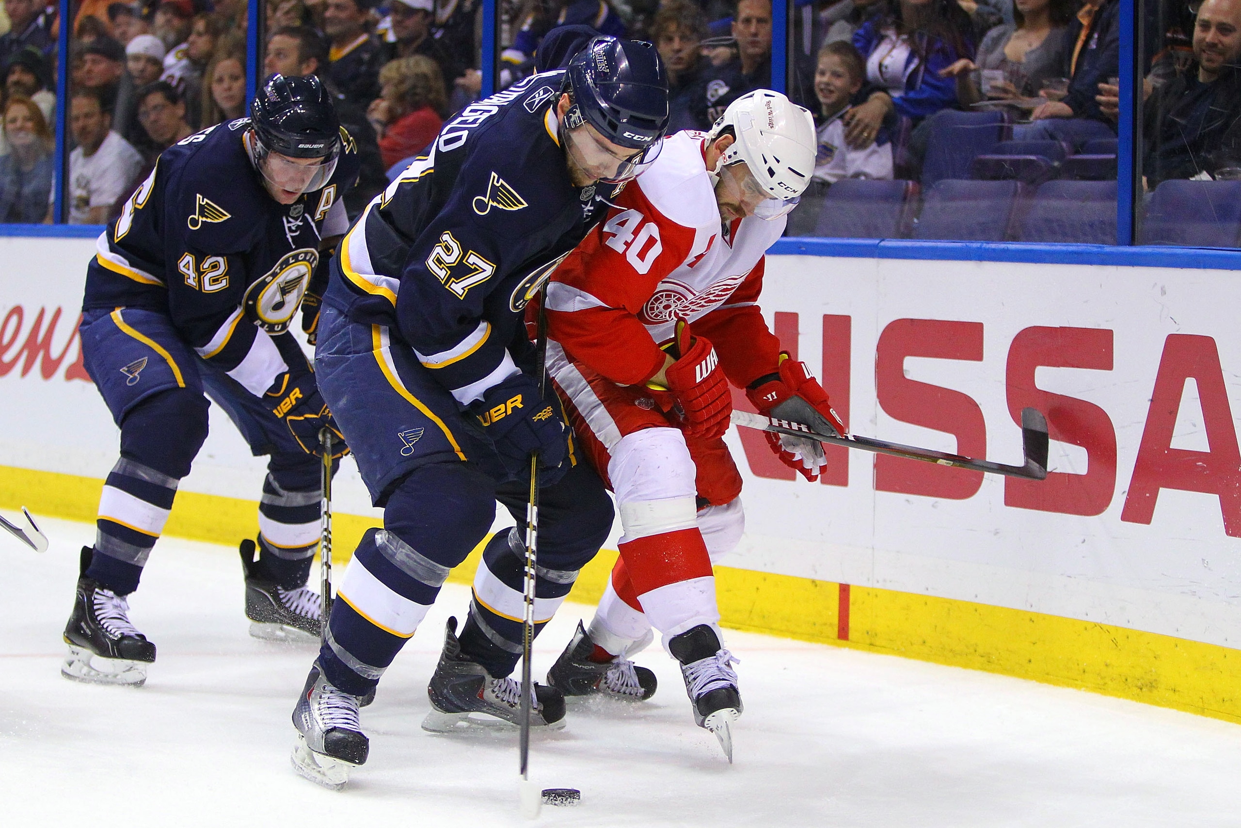 ST. LOUIS, MO - MARCH 12: Alex Pietrangelo #27 and David Backes #42 both of the St. Louis Blues defend against Henrik Zetterberg #40 of the Detroit Red Wings  at the Scottrade Center on March 12, 2011 in St. Louis, Missouri.  (Photo by Dilip Vishwanat/Get