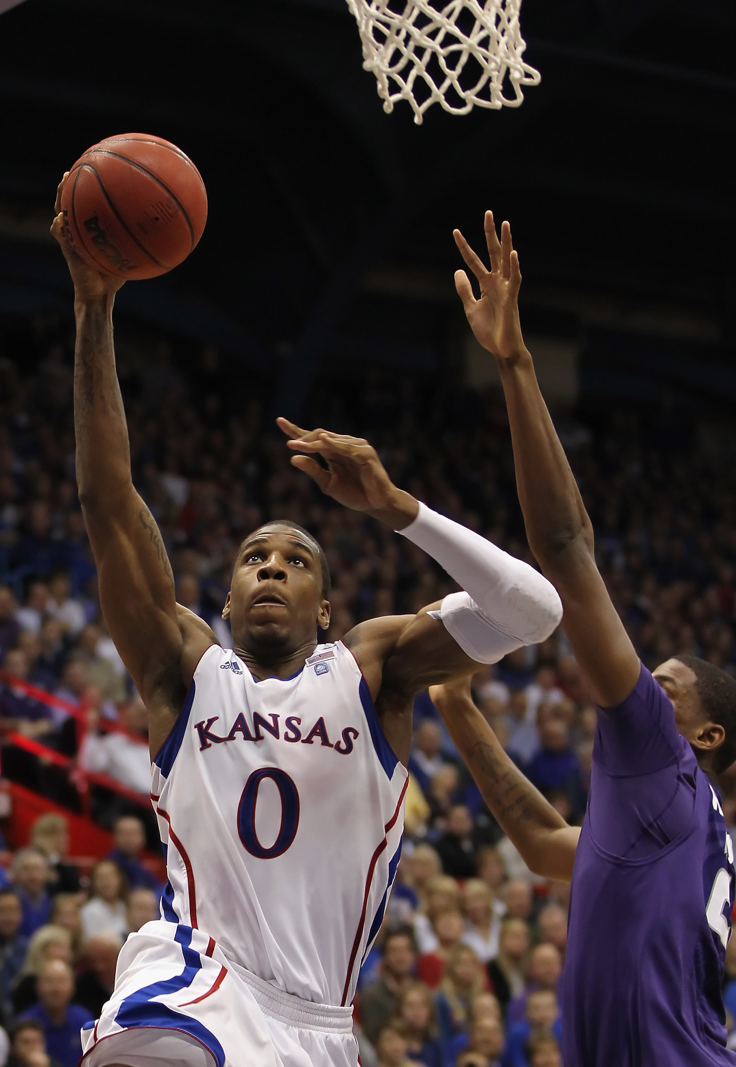 LAWRENCE, KS - JANUARY 29:  Thomas Robinson #0 of the Kansas Jayhawks shoots during the game against the Kansas State Wildcats on January 29, 2011 at Allen Fieldhouse in Lawrence, Kansas.  (Photo by Jamie Squire/Getty Images)