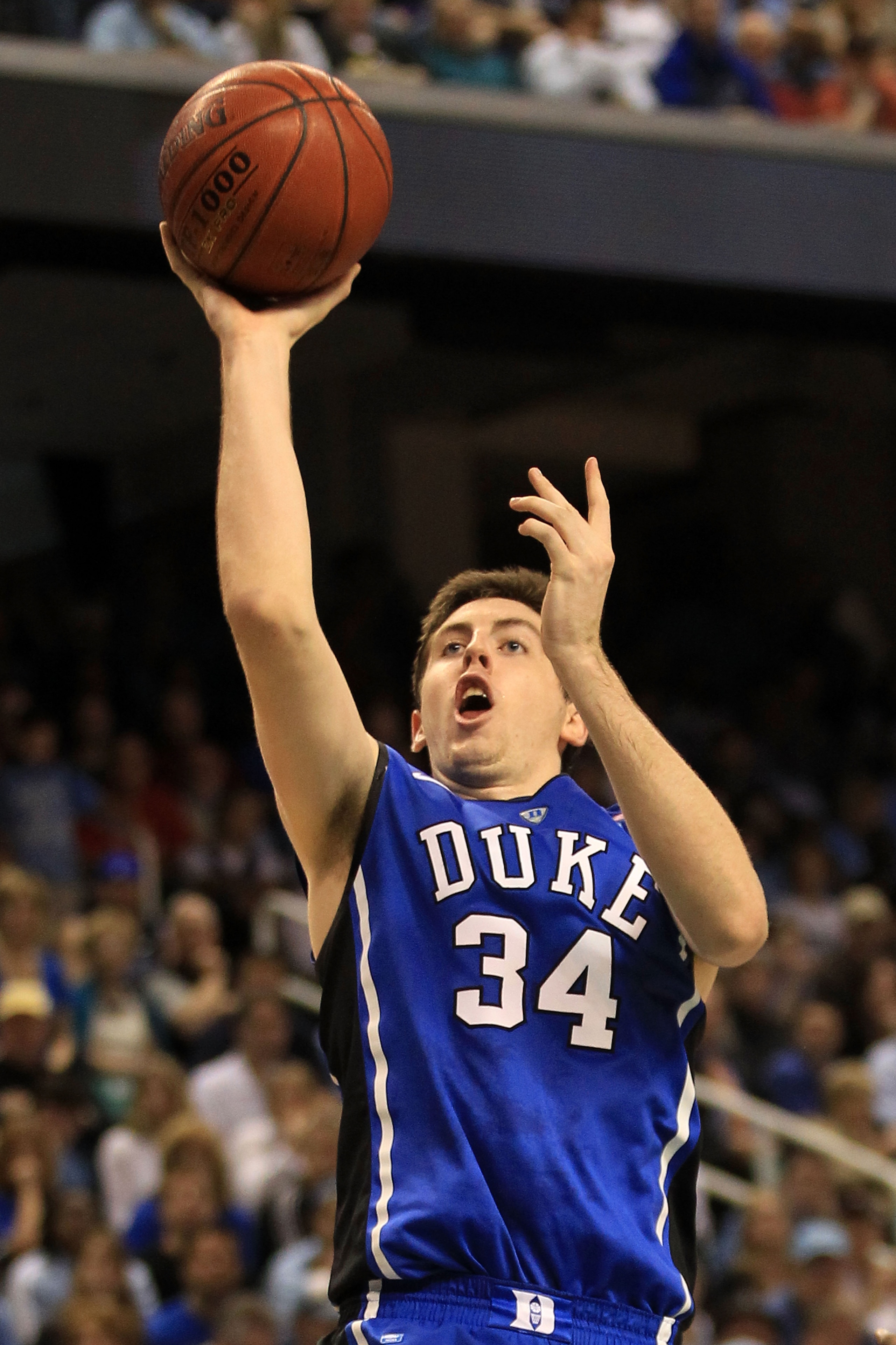 GREENSBORO, NC - MARCH 13:  Ryan Kelly #34 of the Duke Blue Devils shoots against the North Carolina Tar Heels during the first half in the championship game of the 2011 ACC men's basketball tournament at the Greensboro Coliseum on March 13, 2011 in Green