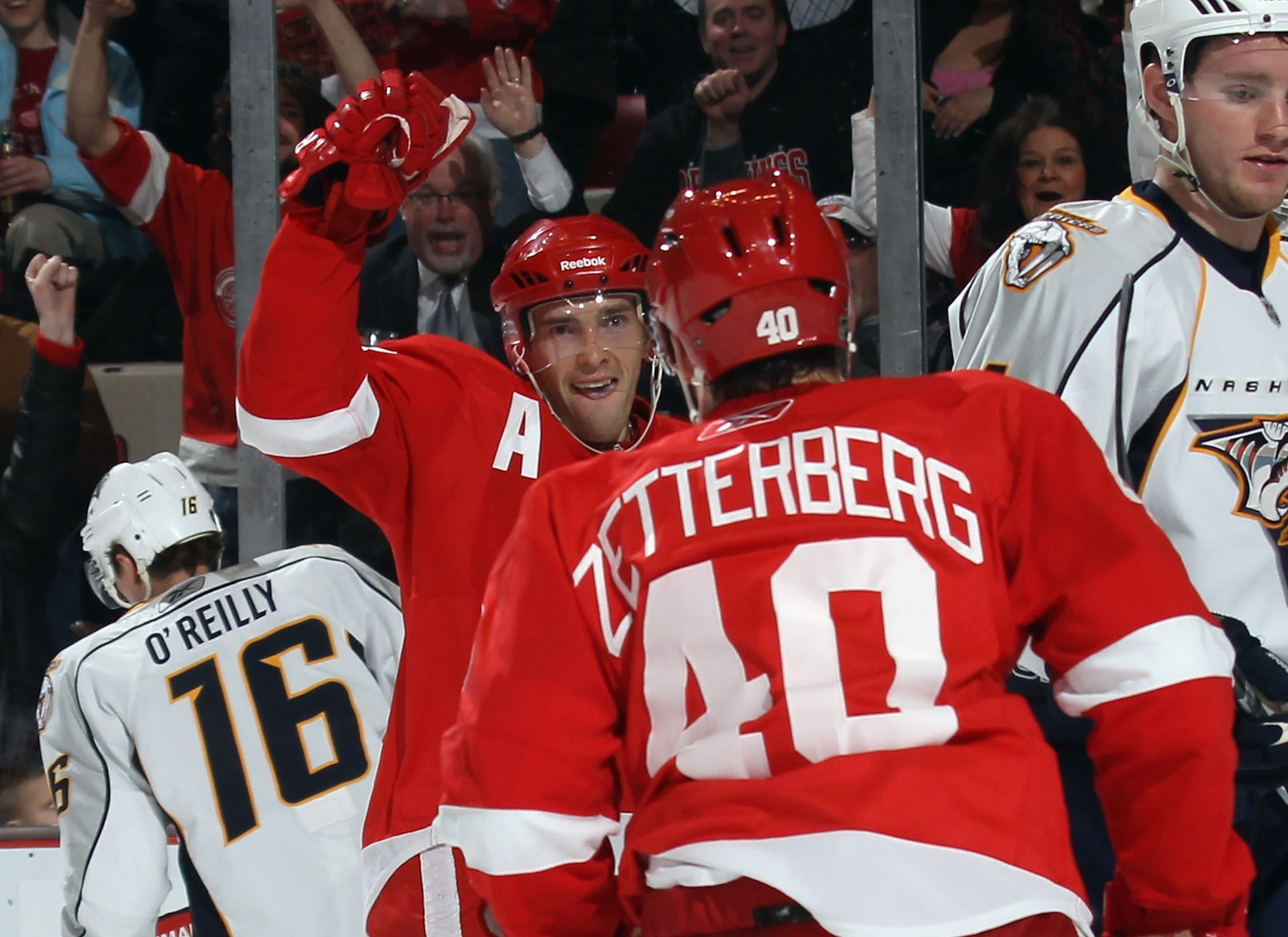 DETROIT, MI - DECEMBER 08: Pavel Datsyuk #13 of the Detroit Red Wings celebrates his short handed goal against the Nashville Predators along with Henrik Zetterberg #40 at the Joe Louis Arena on December 8, 2010 in Detroit, Michigan. The Predators defeated