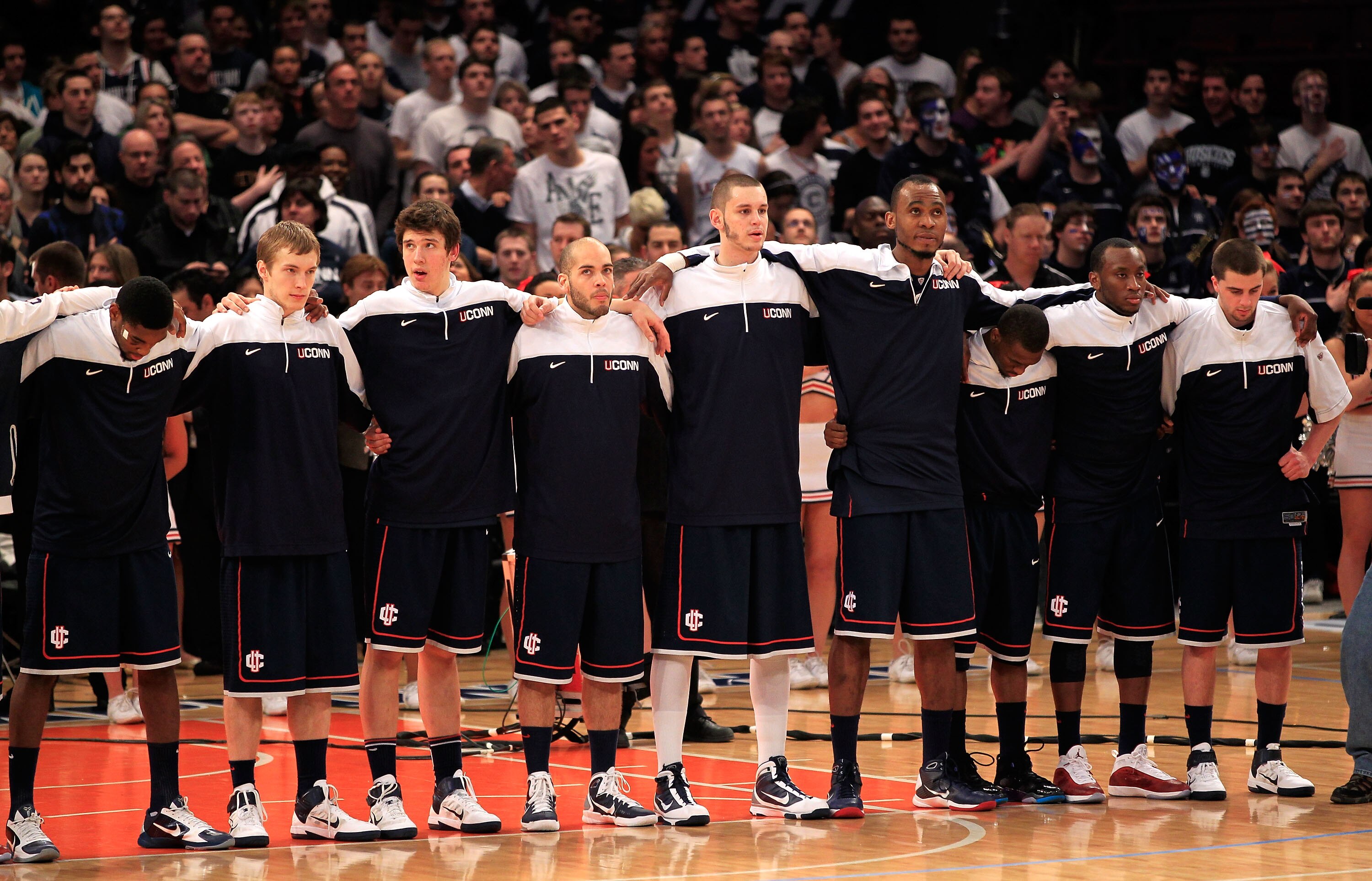 NEW YORK, NY - MARCH 12: The Connecticut Huskies look on during the National Anthem before their game against the Louisville Cardinals during the championship of the 2011 Big East Men's Basketball Tournament presented by American Eagle Outfitters at Madis NEW YORK, NY - MARCH 12: The Connecticut Huskies look on during the National Anthem before their game against the Louisville Cardinals during the championship of the 2011 Big East Men's Basketball Tournament presented by American Eagle Outfitters at Madis
