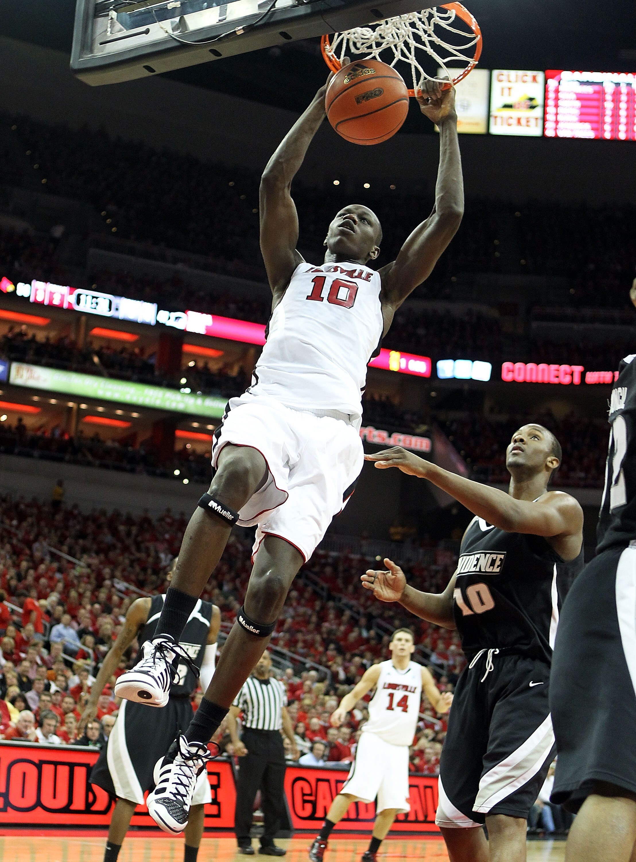 LOUISVILLE, KY - MARCH 02:  Gorgui Dieng #10 of the Louisville Cardinals dunks the ball during the Big East Conference game against the Providence Friars at the KFC Yum! Center on March 2, 2011 in Louisville, Kentucky. Louisville won 87-60.  (Photo by And