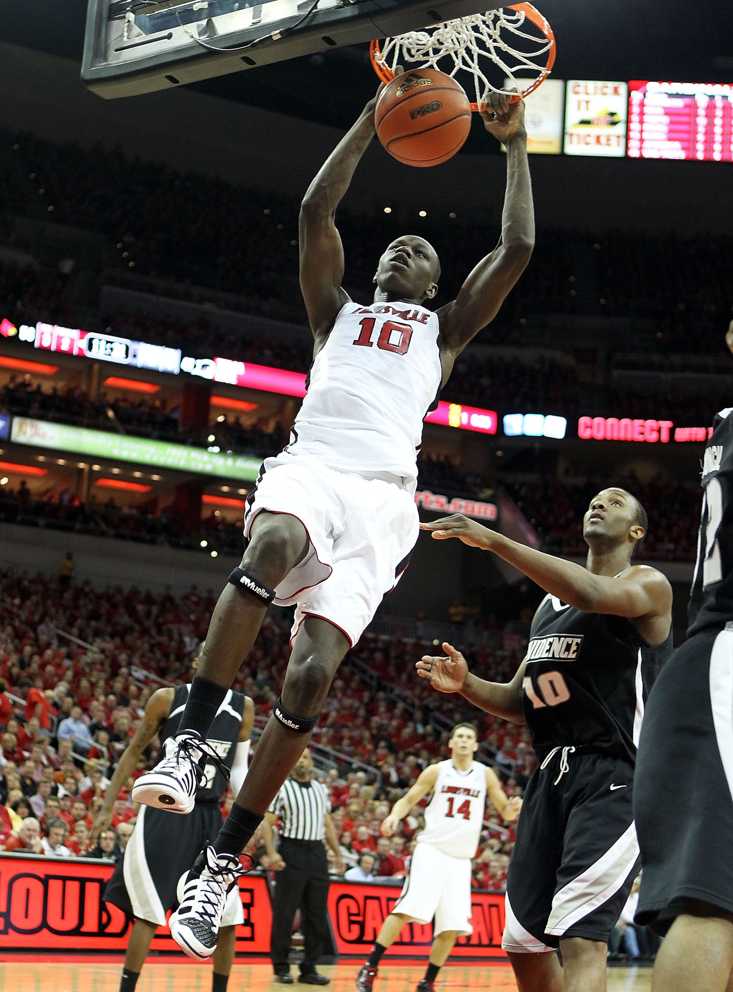 LOUISVILLE, KY - MARCH 02:  Gorgui Dieng #10 of the Louisville Cardinals dunks the ball during the Big East Conference game against the Providence Friars at the KFC Yum! Center on March 2, 2011 in Louisville, Kentucky. Louisville won 87-60.  (Photo by And