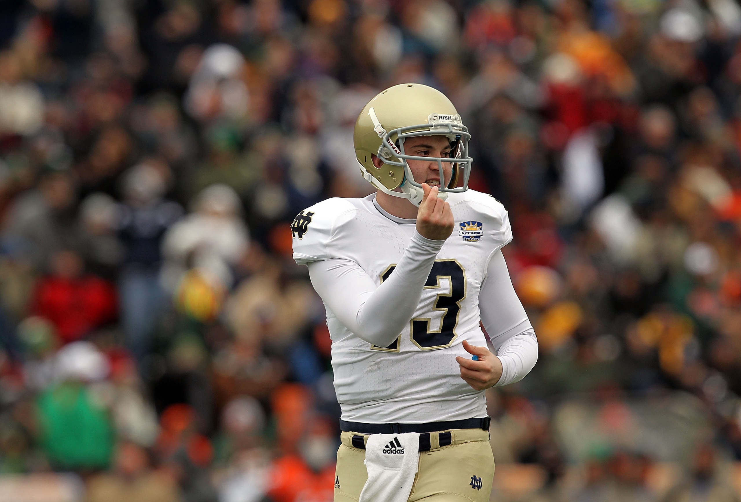 EL PASO, TX - DECEMBER 30:  Quarterback Tommy Rees #13 of the Notre Dame Fighting Irish celebrates a touchdown against the Miami Hurricanes at Sun Bowl on December 30, 2010 in El Paso, Texas.  (Photo by Ronald Martinez/Getty Images)