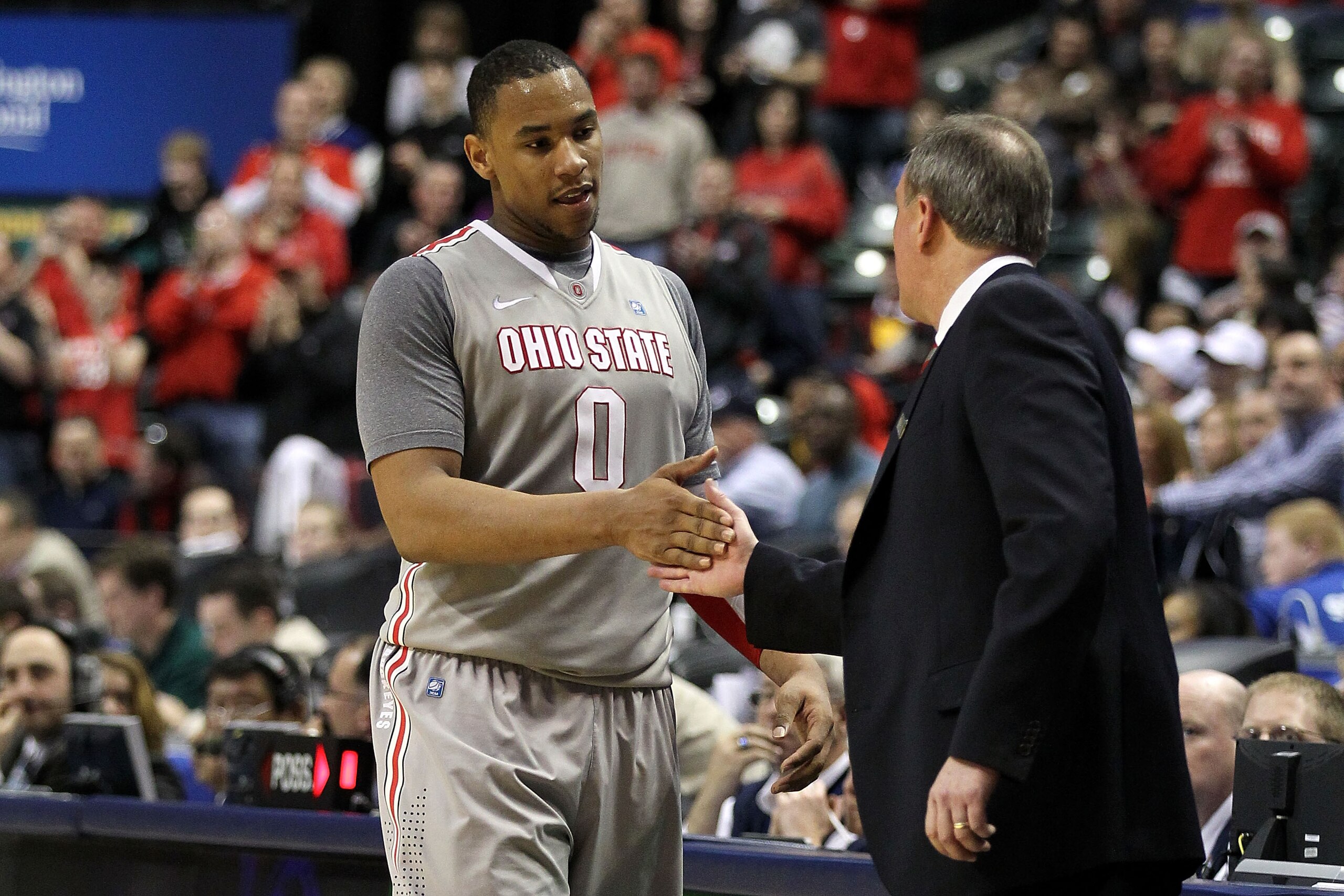 INDIANAPOLIS, IN - MARCH 13:  Jared Sullinger #0 of the Ohio State Buckeyes celebrates with head coach Thad Matta after he was taken out of the game late in the second half against the Penn State Nittany Lions during the championship game of the 2011 Big