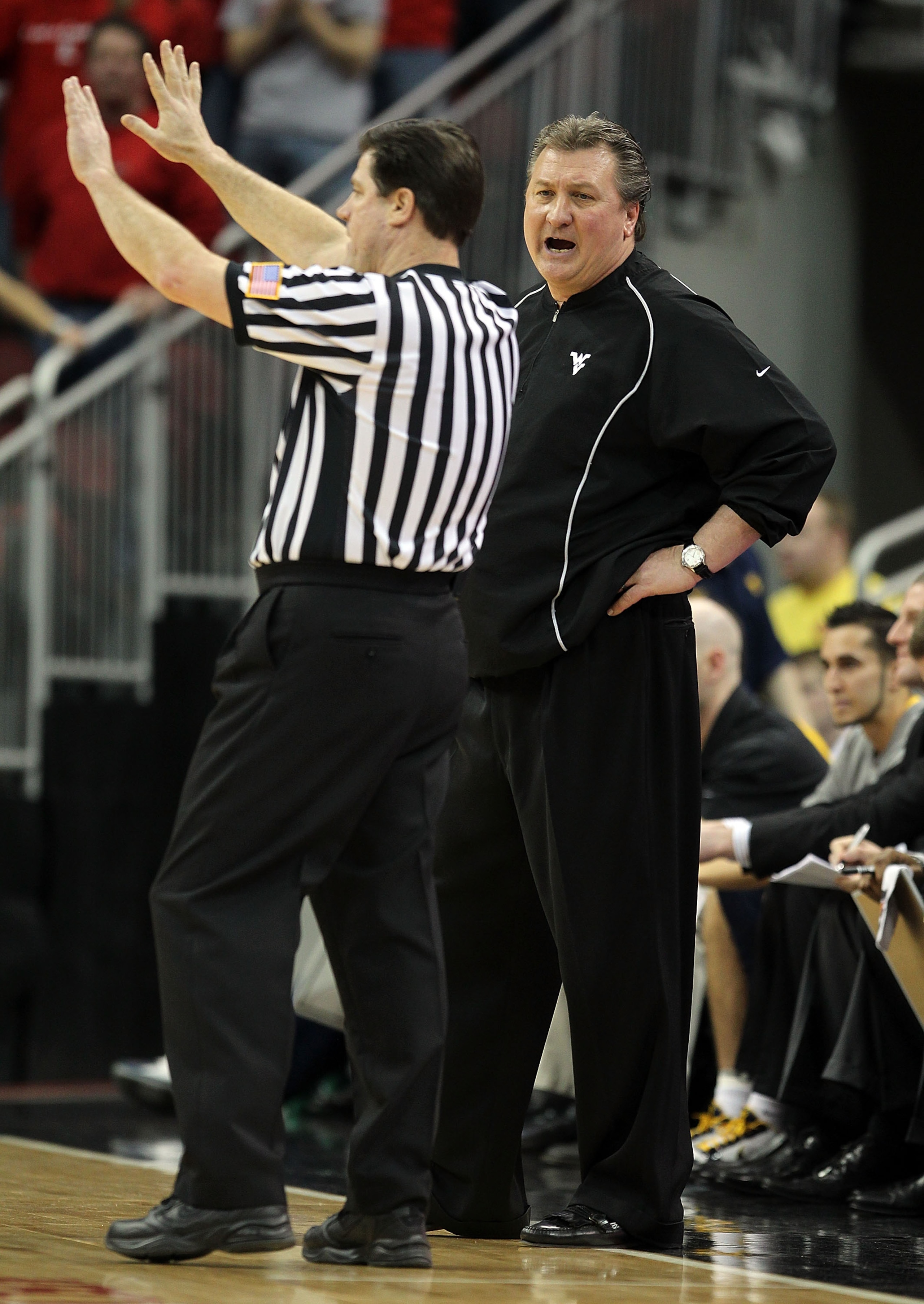 LOUISVILLE, KY - JANUARY 26:  Bob Huggins the Head Coach of the West Virginia Mountaineers yells at a game offical during the Big East Conference game against the Louisville Cardinals at the KFC Yum! Center on January 26, 2011 in Louisville, Kentucky.  Lo