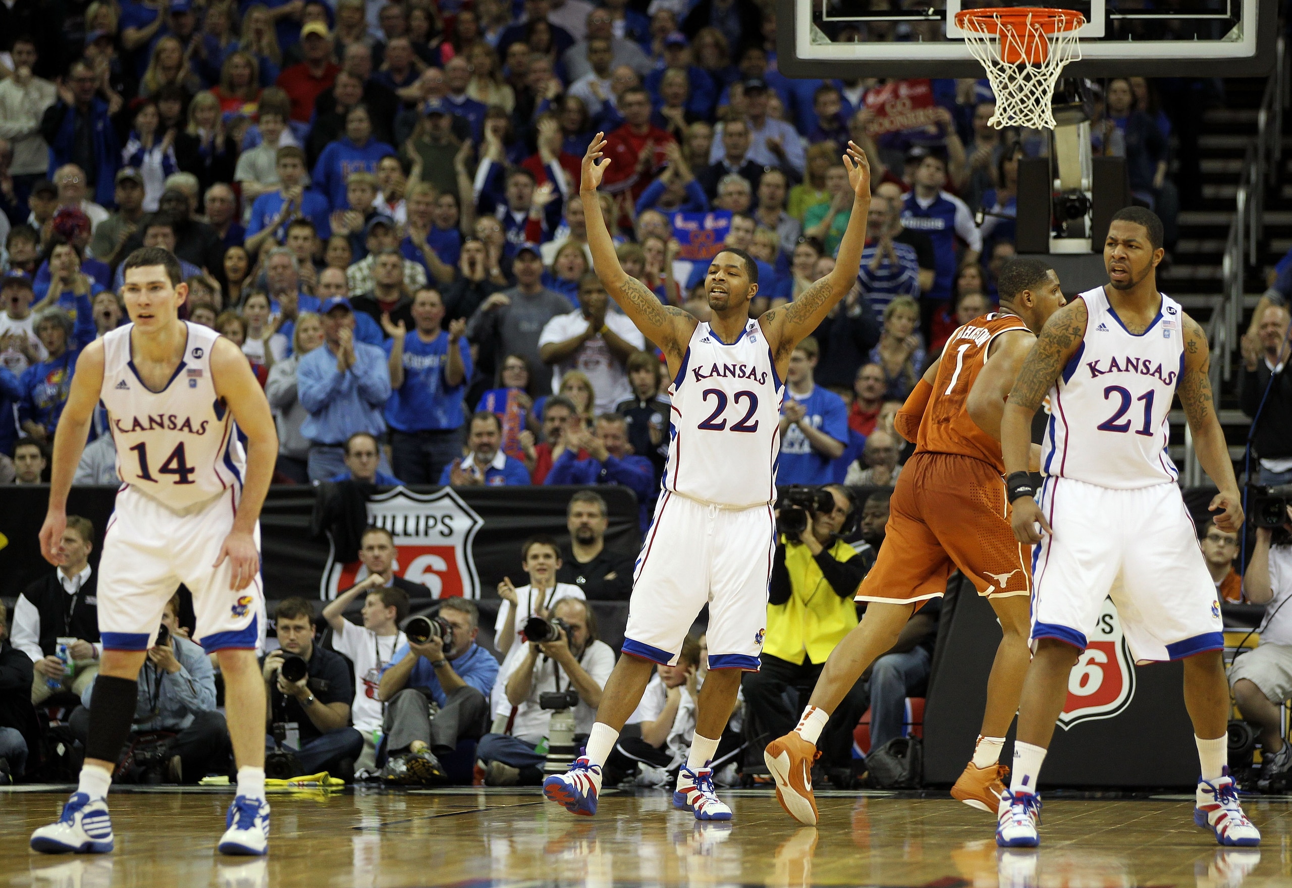KANSAS CITY, MO - MARCH 12:  Marcus Morris #22 of the Kansas Jayhawks reacts to a play against the Texas Longhorns in the second half of the 2011 Phillips 66 Big 12 Men's Basketball Tournament championship game against the Kansas Jayhawks at Sprint Center