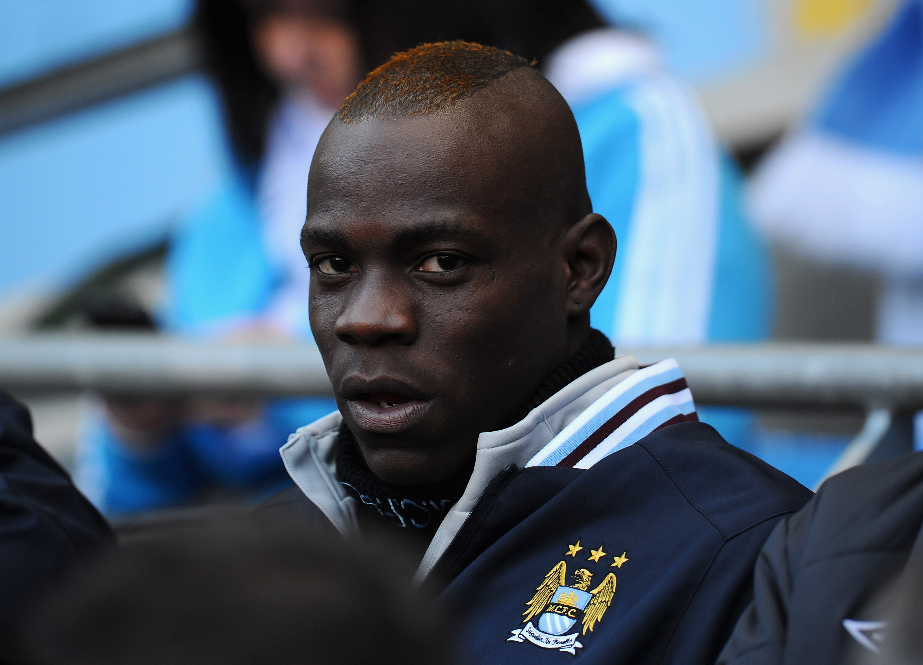 MANCHESTER, ENGLAND - MARCH 13:  Mario Balotelli of Manchester City sits on the bench ahead of the FA Cup sponsored by E.On Sixth Round match between Manchester City and Reading at the City of Manchester Stadium on March 13, 2011 in Manchester, England.